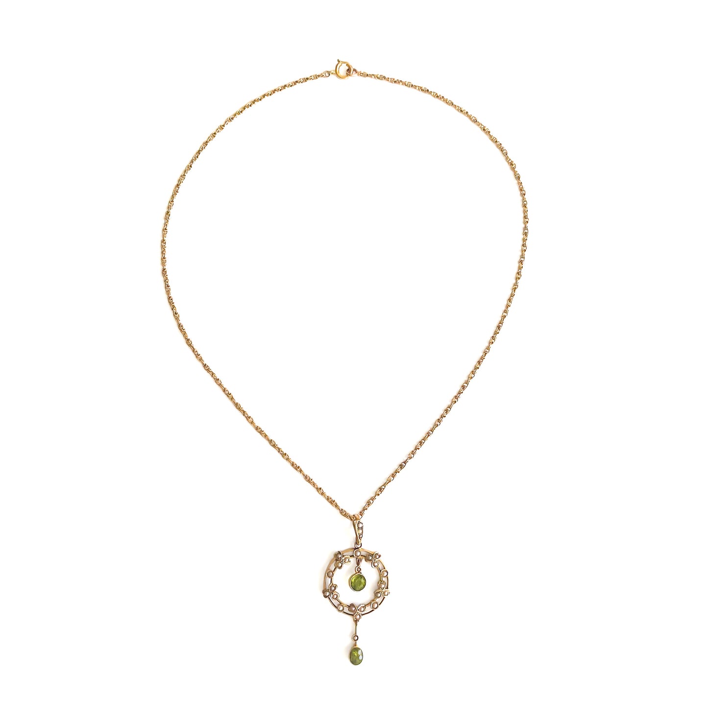 Stunning Edwardian 9ct gold dangling pendant set with two beautifully faceted green peridots and twenty-four tiny seed pearls. On an original 9ct gold fancy link chain.