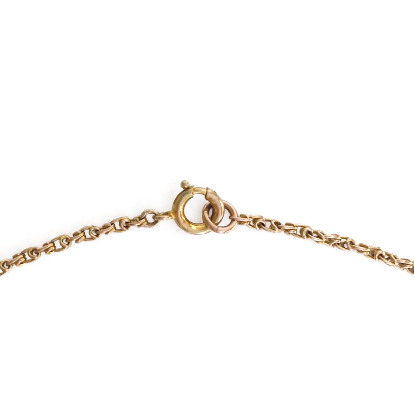 Stunning Edwardian 9ct gold dangling pendant set with two beautifully faceted green peridots and twenty-four tiny seed pearls. On an original 9ct gold fancy link chain.