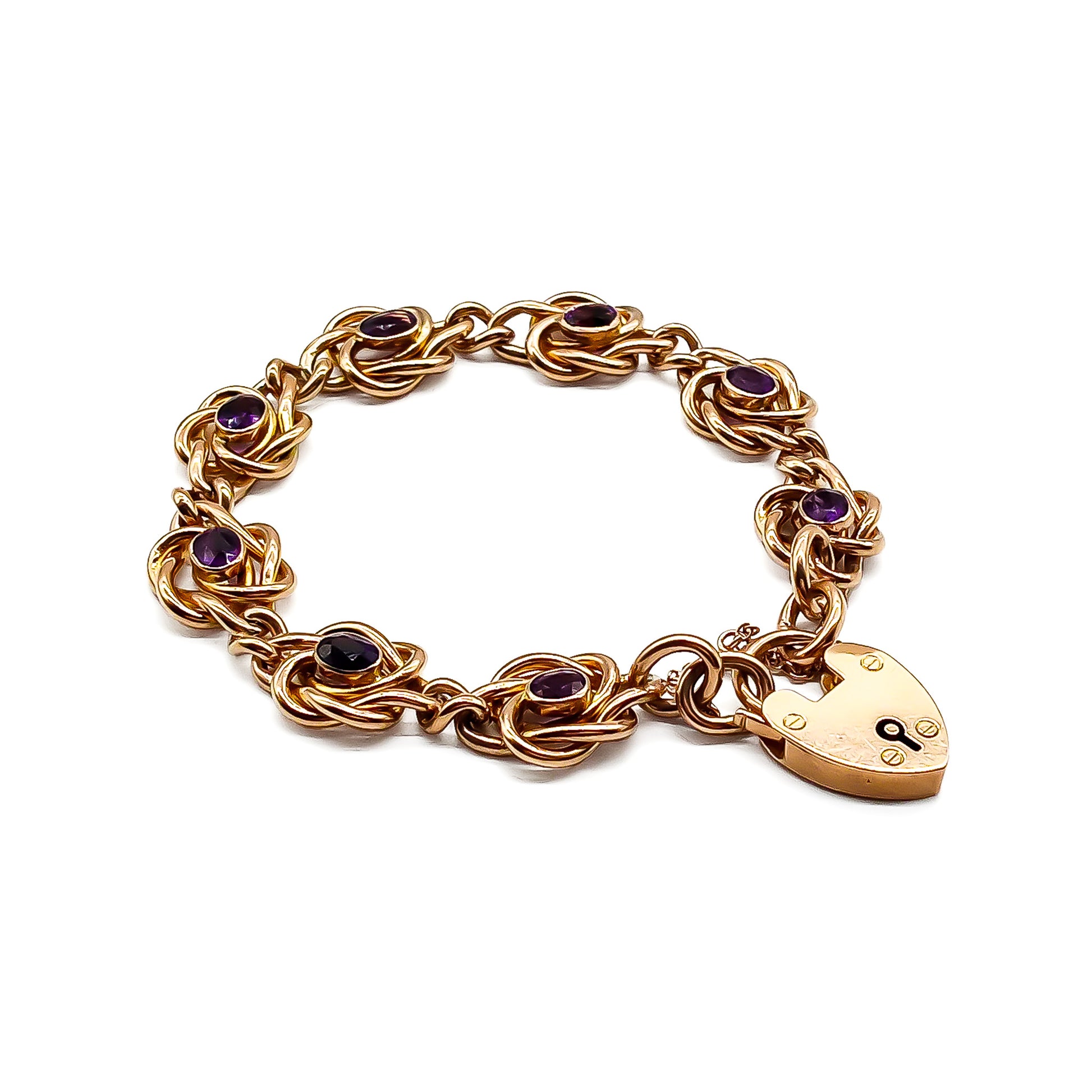 Stunning Edwardian rose gold bracelet set with eight faceted dark purple amethysts, with a padlock and safety chain. Birmingham 1908