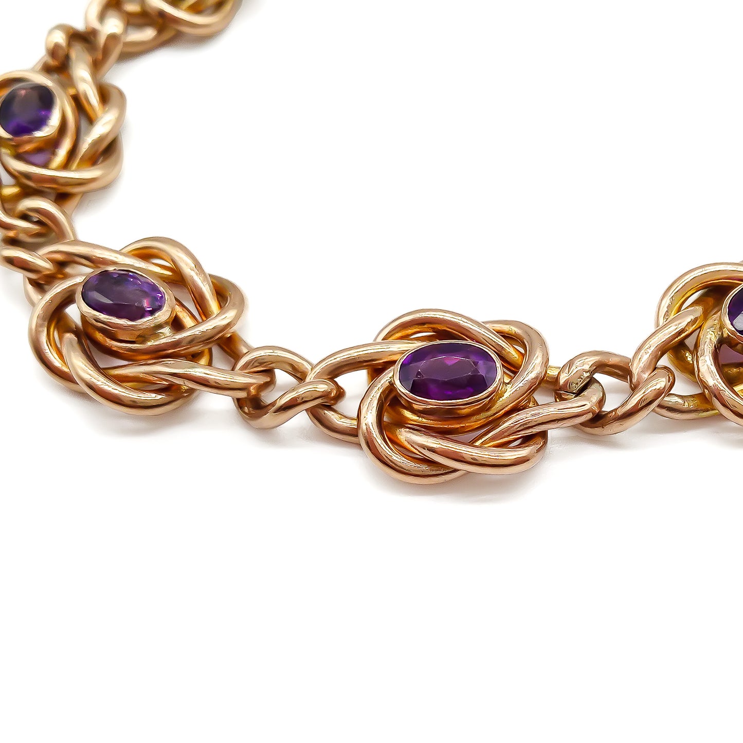 Stunning Edwardian rose gold bracelet set with eight faceted dark purple amethysts, with a padlock and safety chain. Birmingham 1908