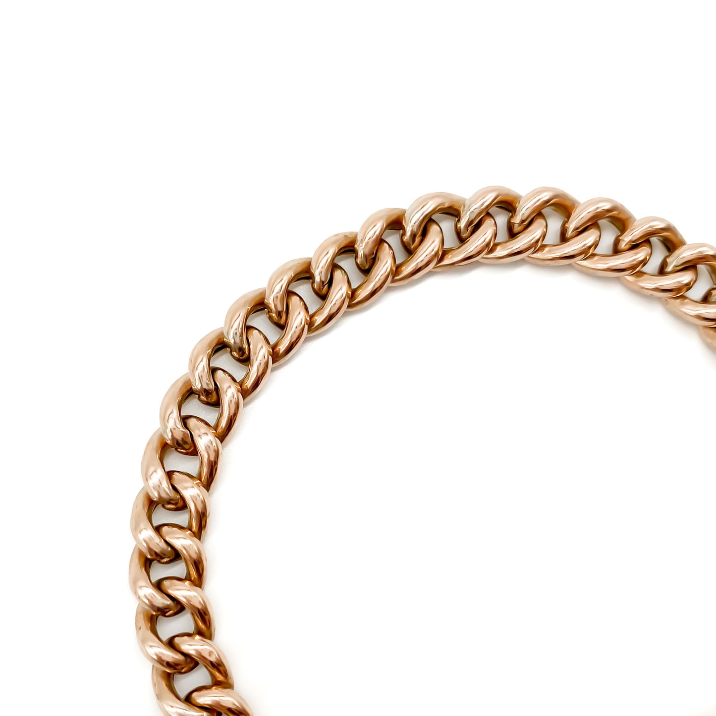 Classic Edwardian 9ct rose gold curb link bracelet with padlock and safety chain.