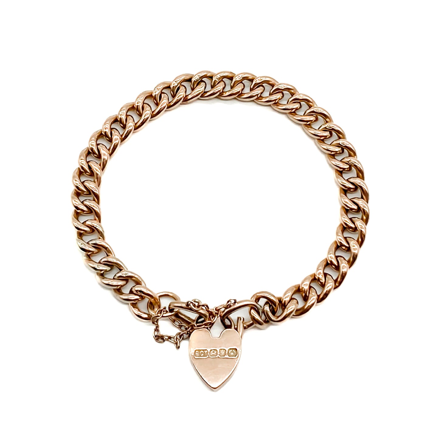 Classic Edwardian 9ct rose gold curb link bracelet with padlock and safety chain.