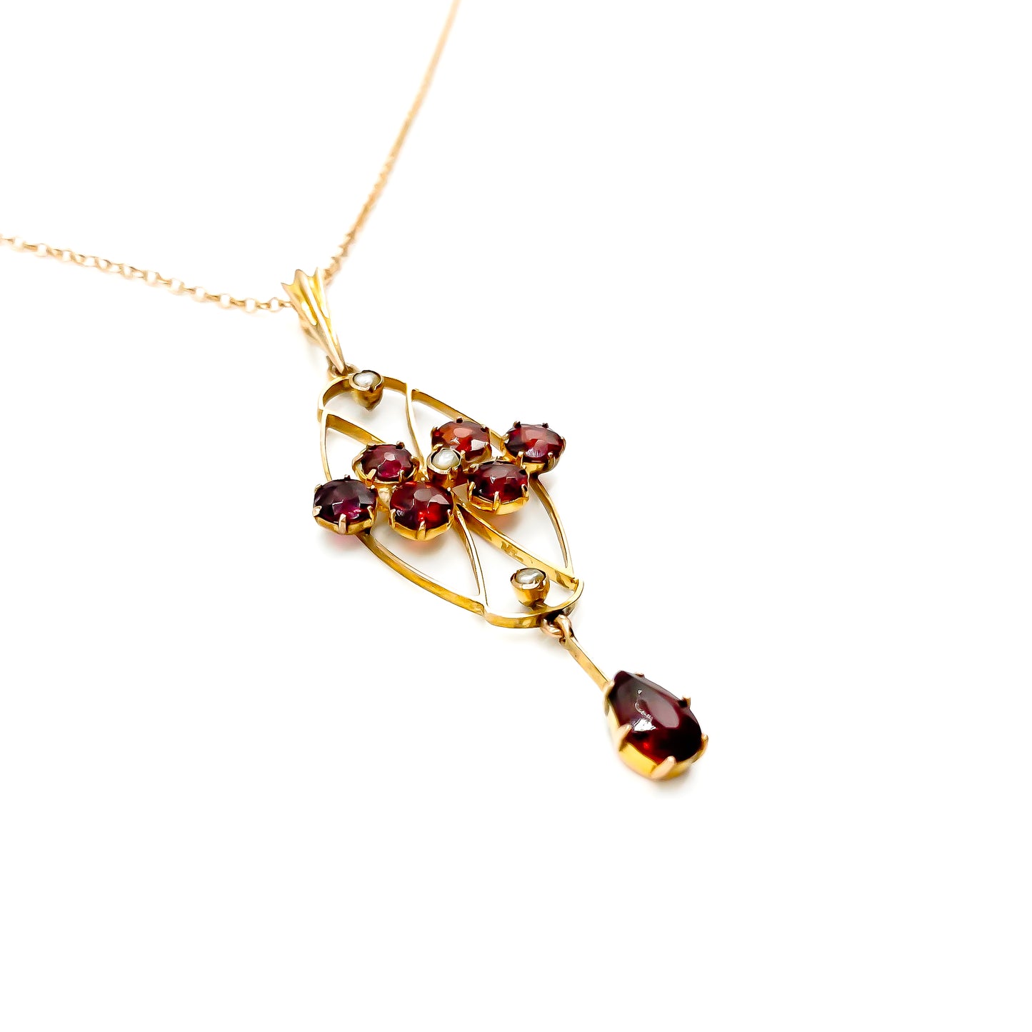 Delicate Edwardian 9ct rose gold garnet and seed pearl pendant on a 9ct rose gold chain.