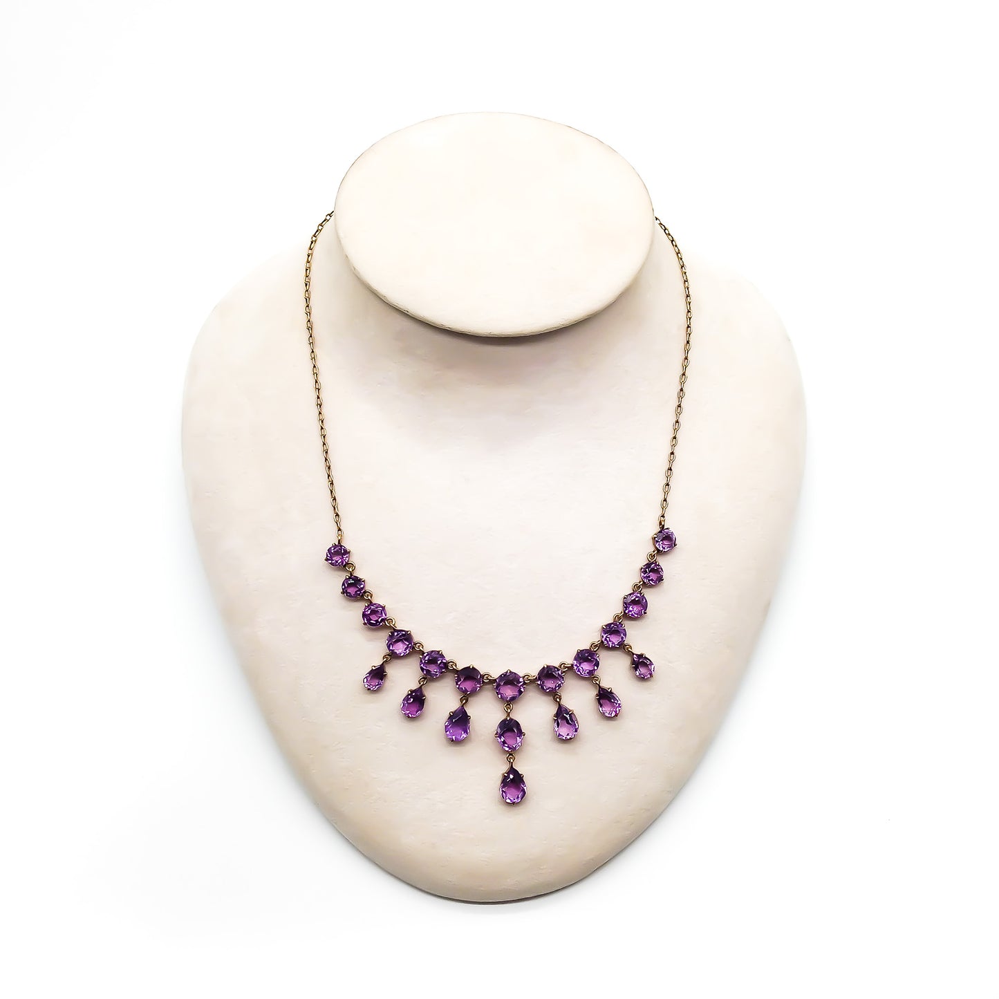 Stunning Edwardian gold plated on silver festoon necklace set with twenty-one beautifully faceted amethysts.