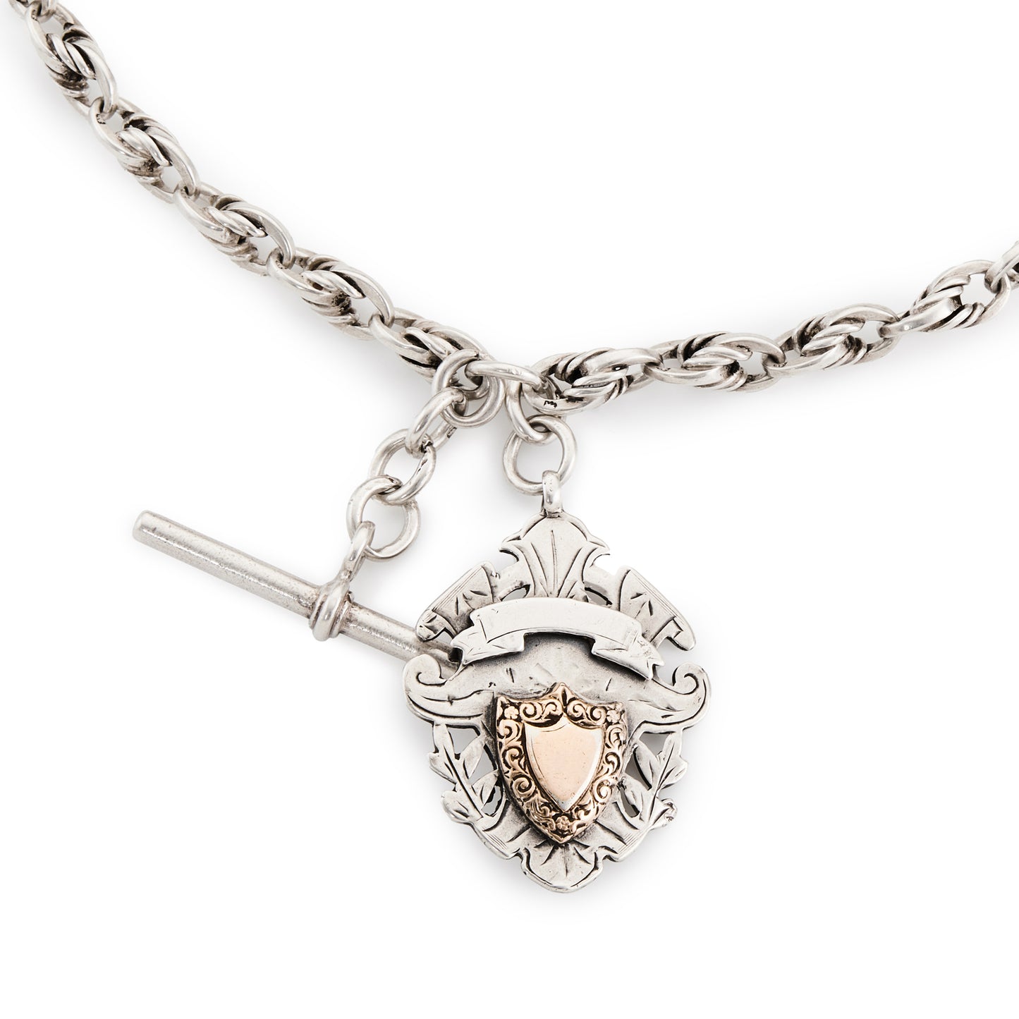 Stunning Edwardian Sterling silver ornate link fob chain with two later dog clips and a fully marked t-bar, as well as a silver medallion embellished with a rose gold shield (Birmingham 1906).