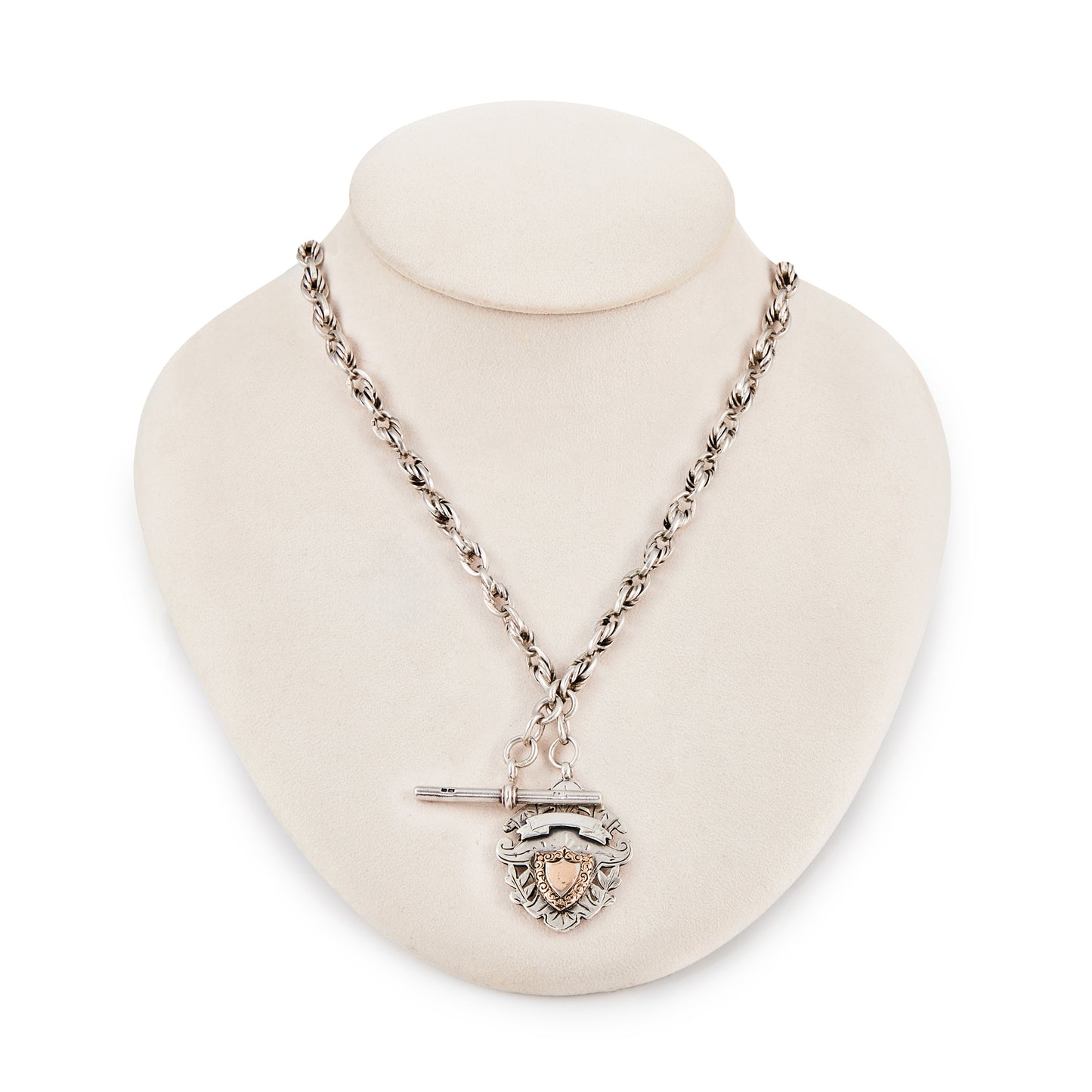 Stunning Edwardian Sterling silver ornate link fob chain with two later dog clips and a fully marked t-bar, as well as a silver medallion embellished with a rose gold shield (Birmingham 1906).
