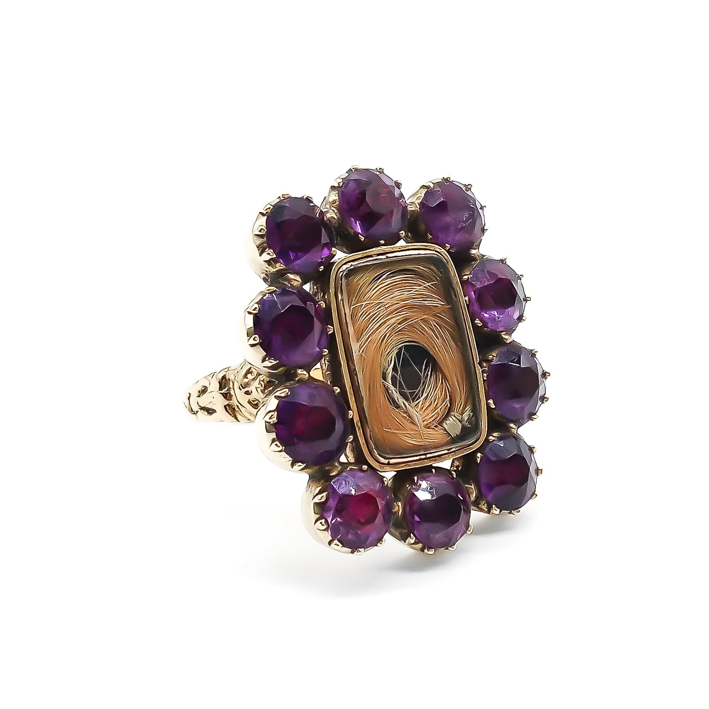 Gorgeous Georgian mourning ring comprising of a 15ct yellow gold setting with hair under glass, surrounded by ten deep purple amethysts. Beautifully engraved later shank.