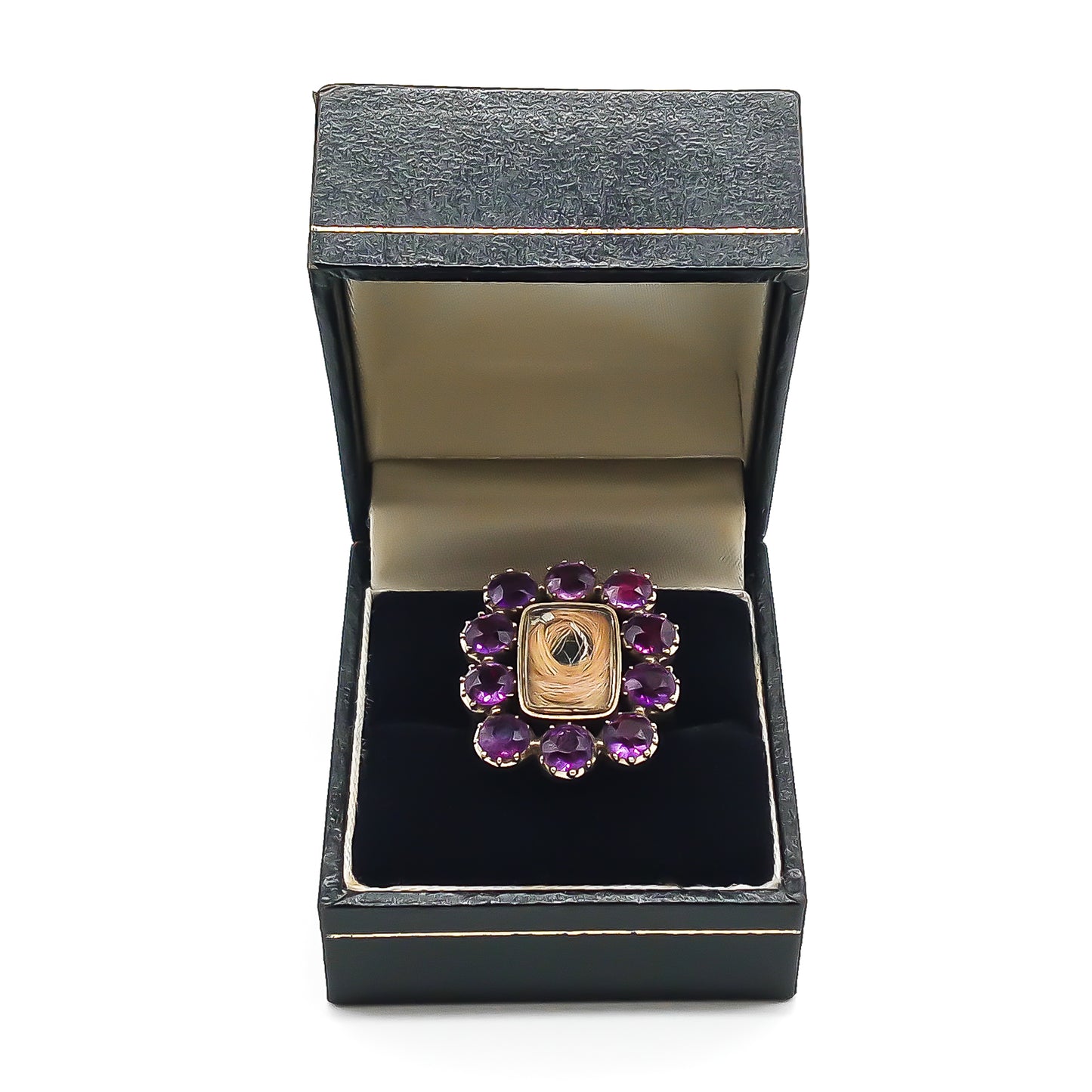 Gorgeous Georgian mourning ring comprising of a 15ct yellow gold setting with hair under glass, surrounded by ten deep purple amethysts. Beautifully engraved later shank.