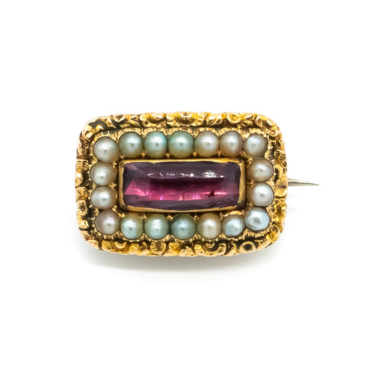 Charming miniature Georgian 15ct gold brooch set with a faceted amethyst surrounded by eighteen seed pearls. 