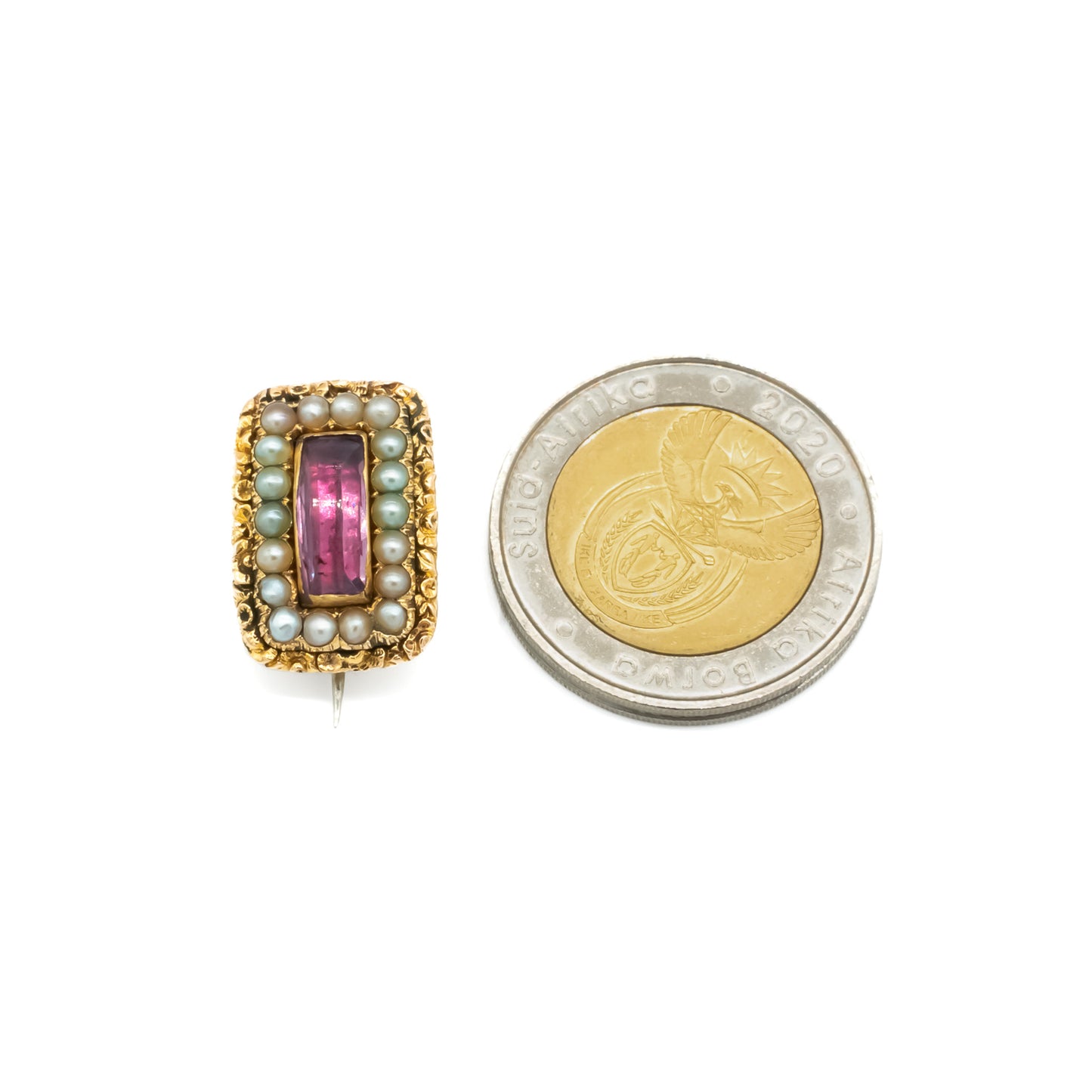 Charming miniature Georgian 15ct gold brooch set with a faceted amethyst surrounded by eighteen seed pearls. 