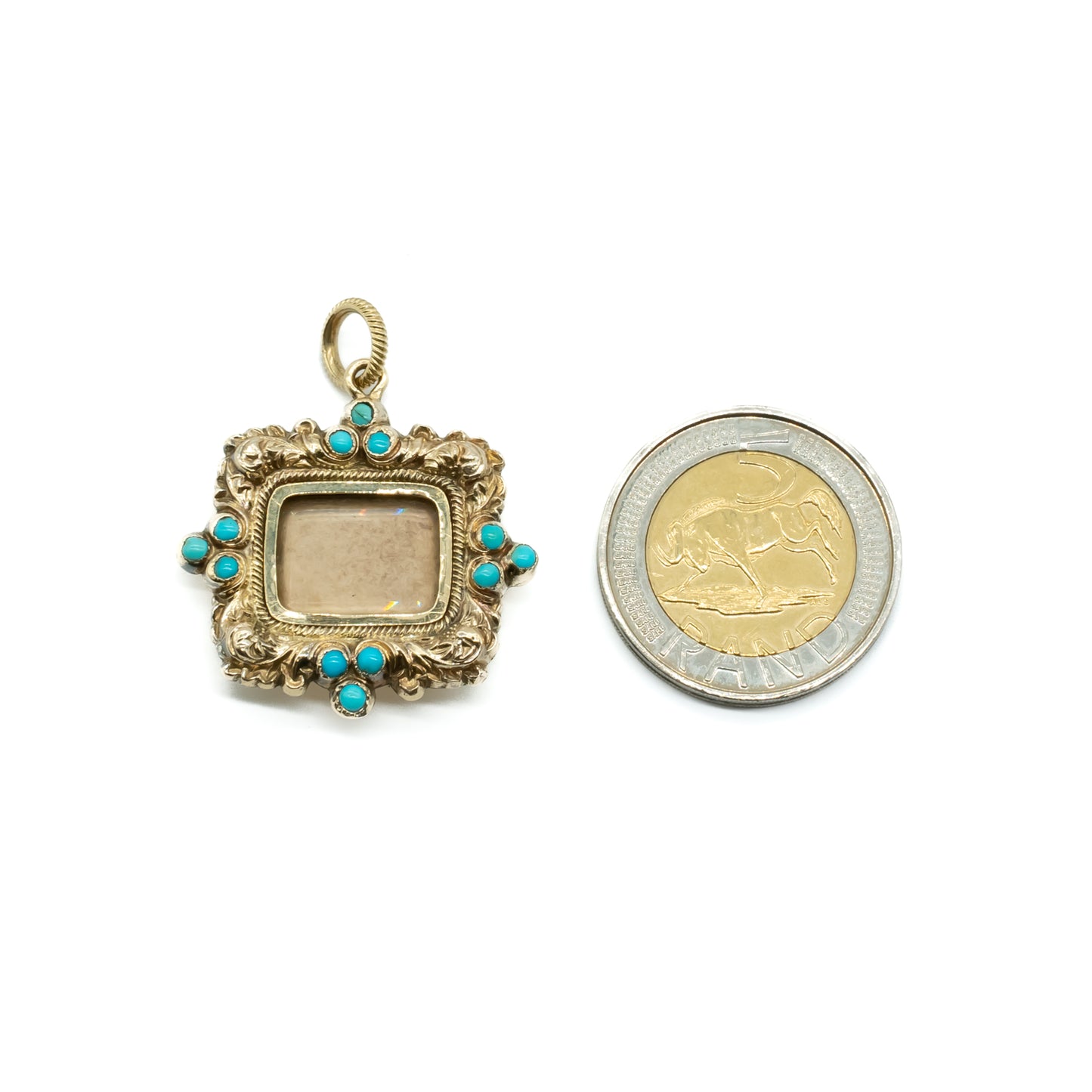 Exquisite Georgian 9ct gold cased mourning pendant set with 12 small round turquoise stones. Rectangular piece of glass in centre - ideal for photo.