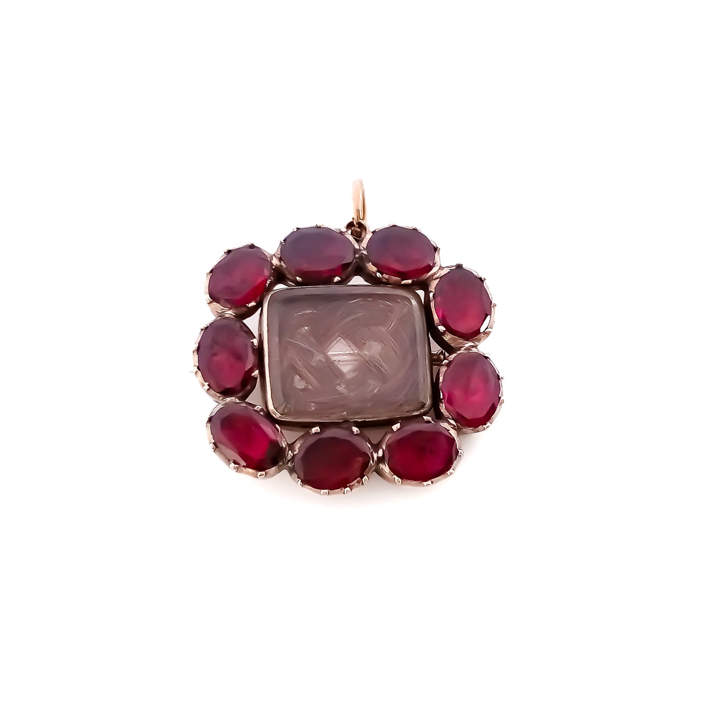 Charming Georgian 9ct rose gold mourning brooch with plaited hair under bevelled glass surrounded by nine Bohemian garnets. 