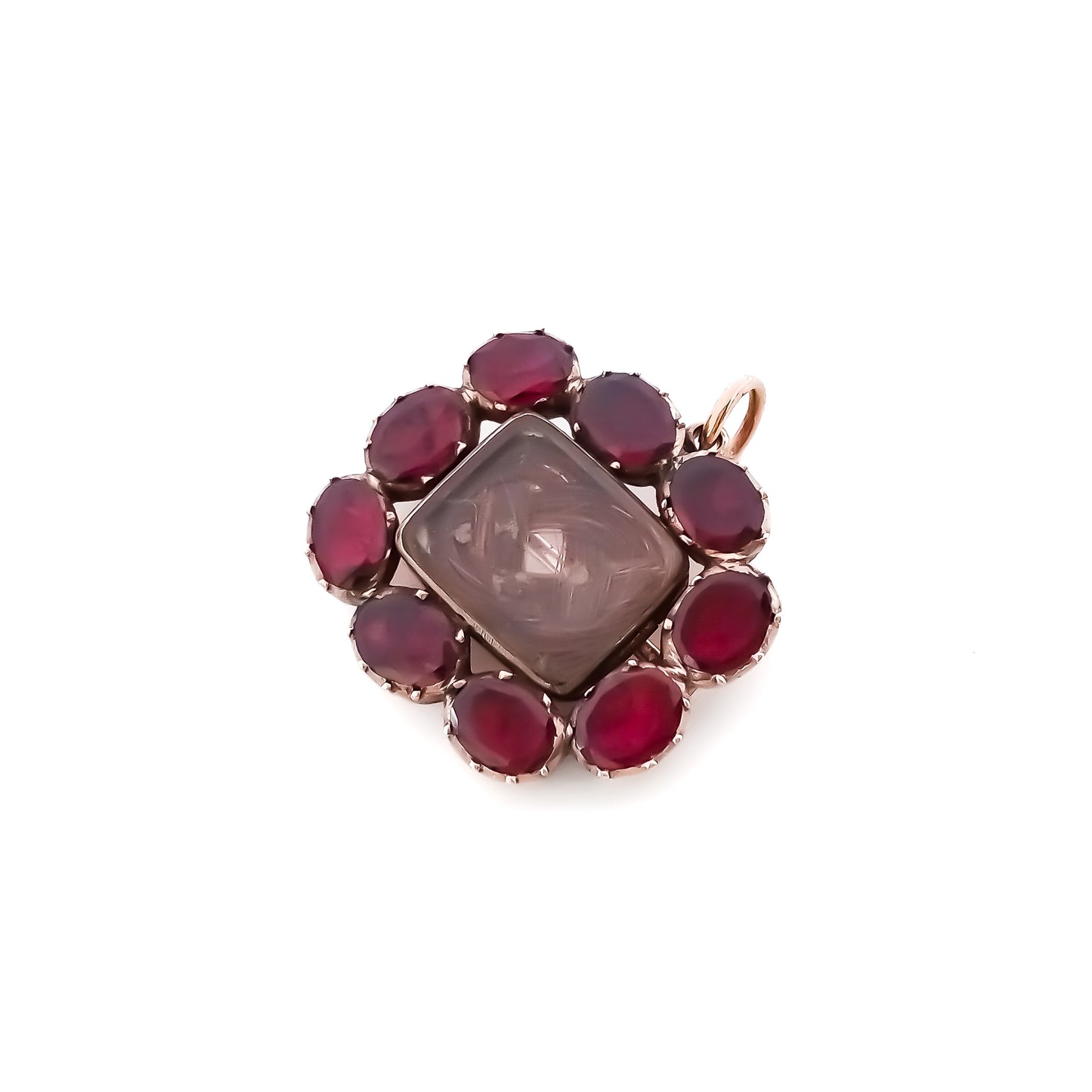 Charming Georgian 9ct rose gold mourning brooch with plaited hair under bevelled glass surrounded by nine Bohemian garnets. 