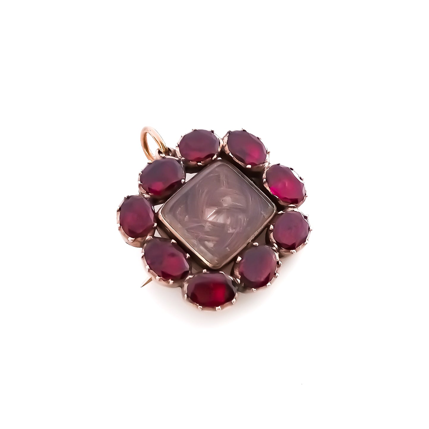 Charming Georgian 9ct rose gold mourning brooch with plaited hair under bevelled glass surrounded by nine Bohemian garnets.