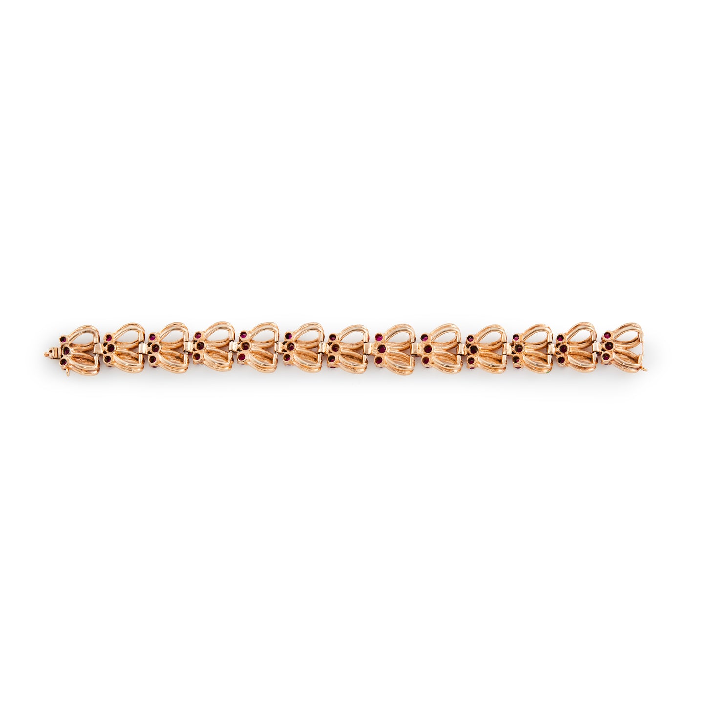 Stylish gold plated on silver articulated bracelet, set with man-made rubies. Signed Norman Hartnell. London 1958.