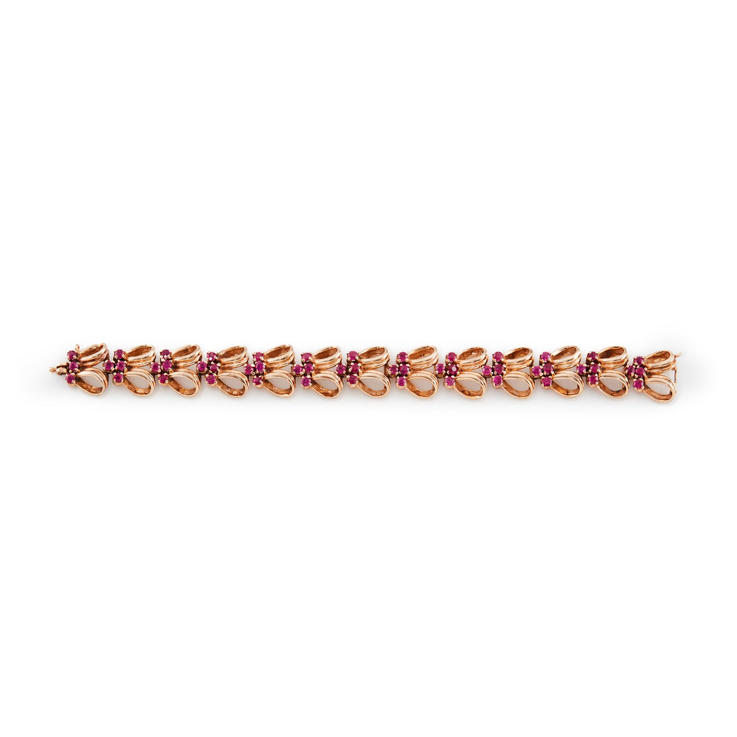 Stylish gold plated on silver articulated bracelet, set with man-made rubies. Signed Norman Hartnell. London 1958.