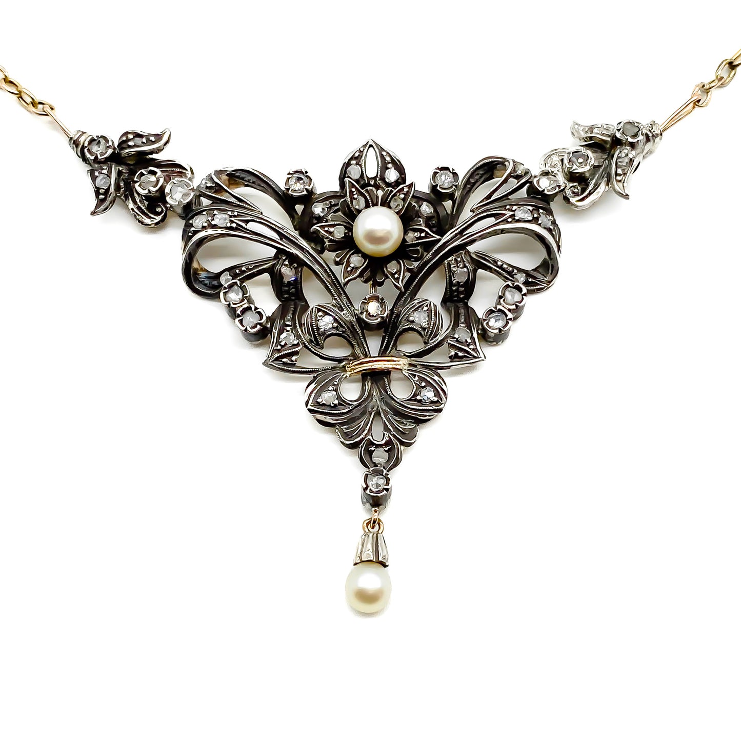 Gorgeous Edwardian gold and silver necklace set with old-cut diamonds and two pearls. Circa 1910