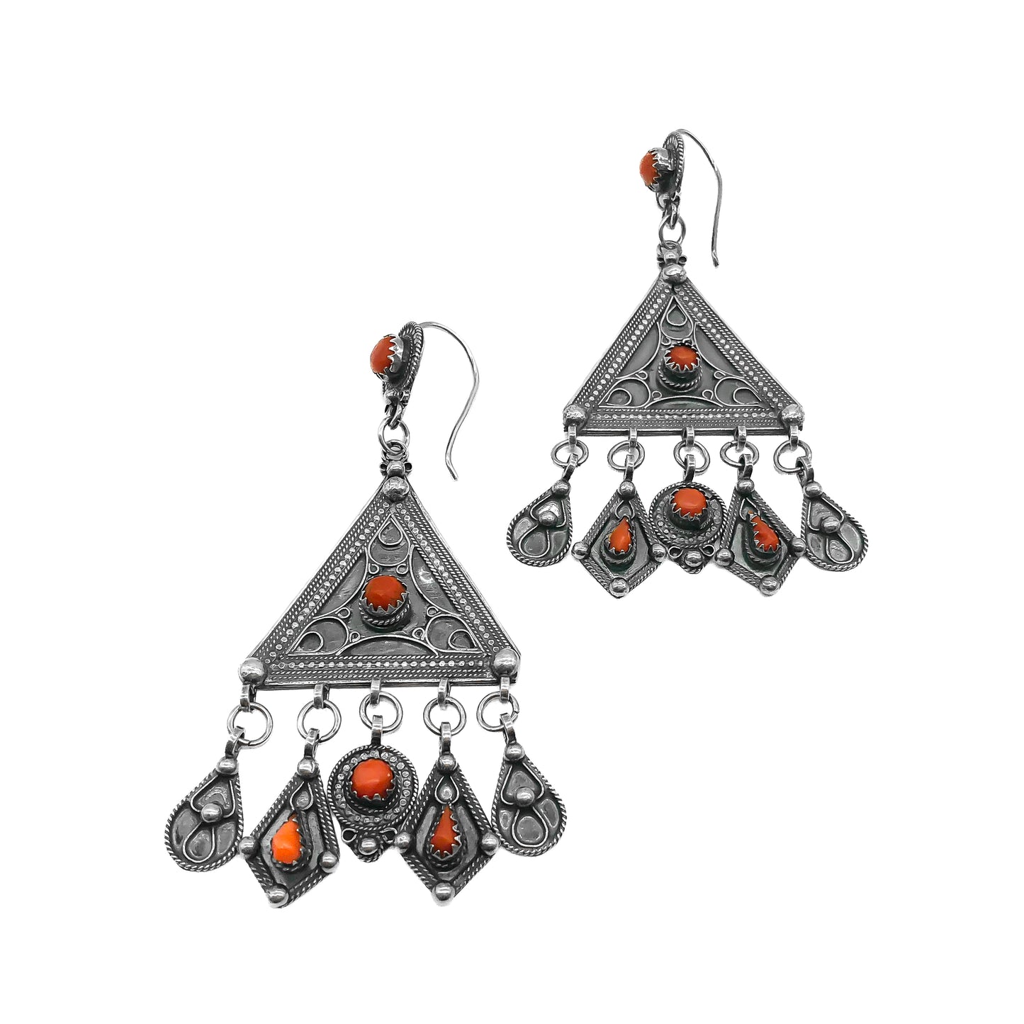 Magnificent ethnic oxidised silver chandelier earrings set with deep red coral cabochons. These large statement earrings are beautifully embossed.