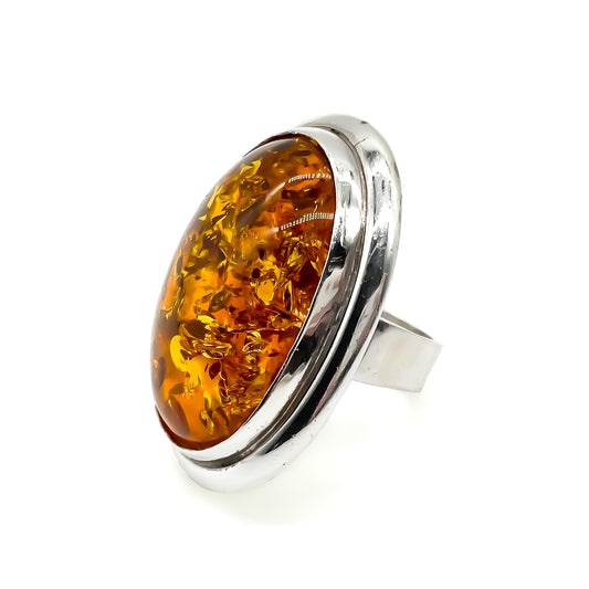 Magnificent sterling silver ring set with a large oval piece of amber.