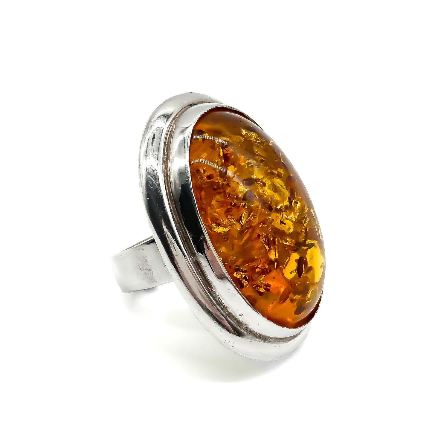 Magnificent sterling silver ring set with a large oval piece of amber.