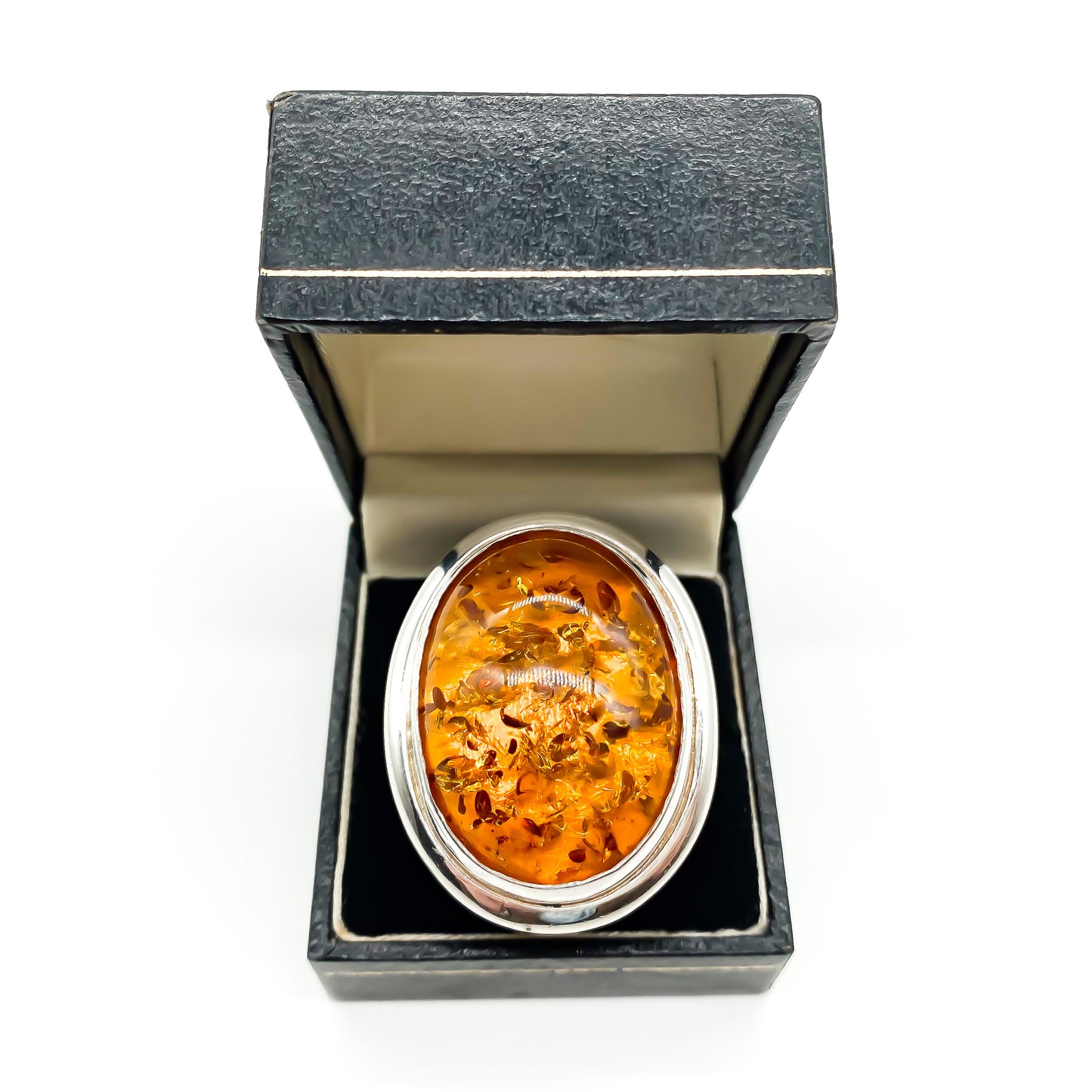 Magnificent sterling silver ring set with a large oval piece of amber.