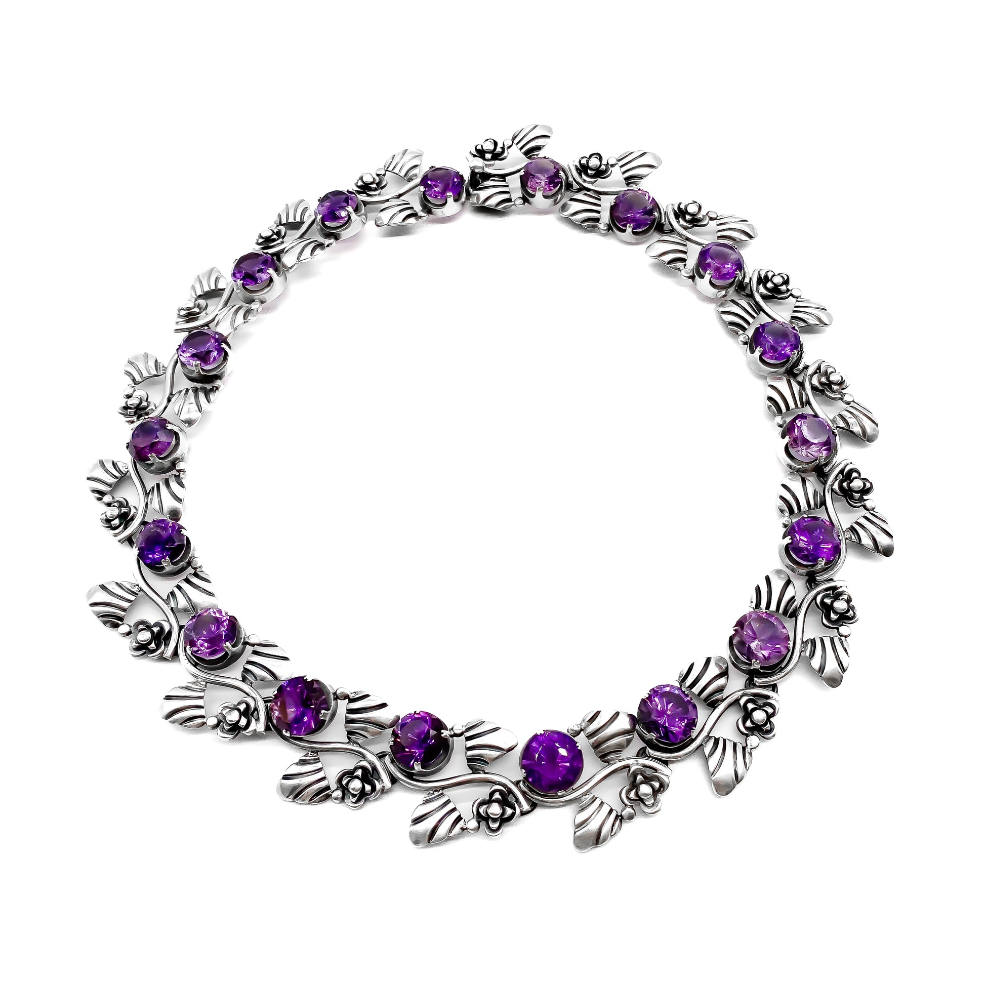Stunning sterling silver Mexican choker necklace set with eighteen round, faceted amethysts. Circa 1950’s