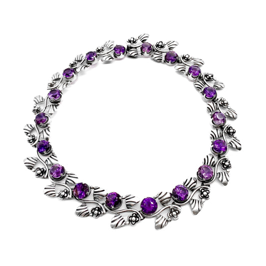 Stunning sterling silver Mexican choker necklace set with eighteen round, faceted amethysts. Circa 1950’s