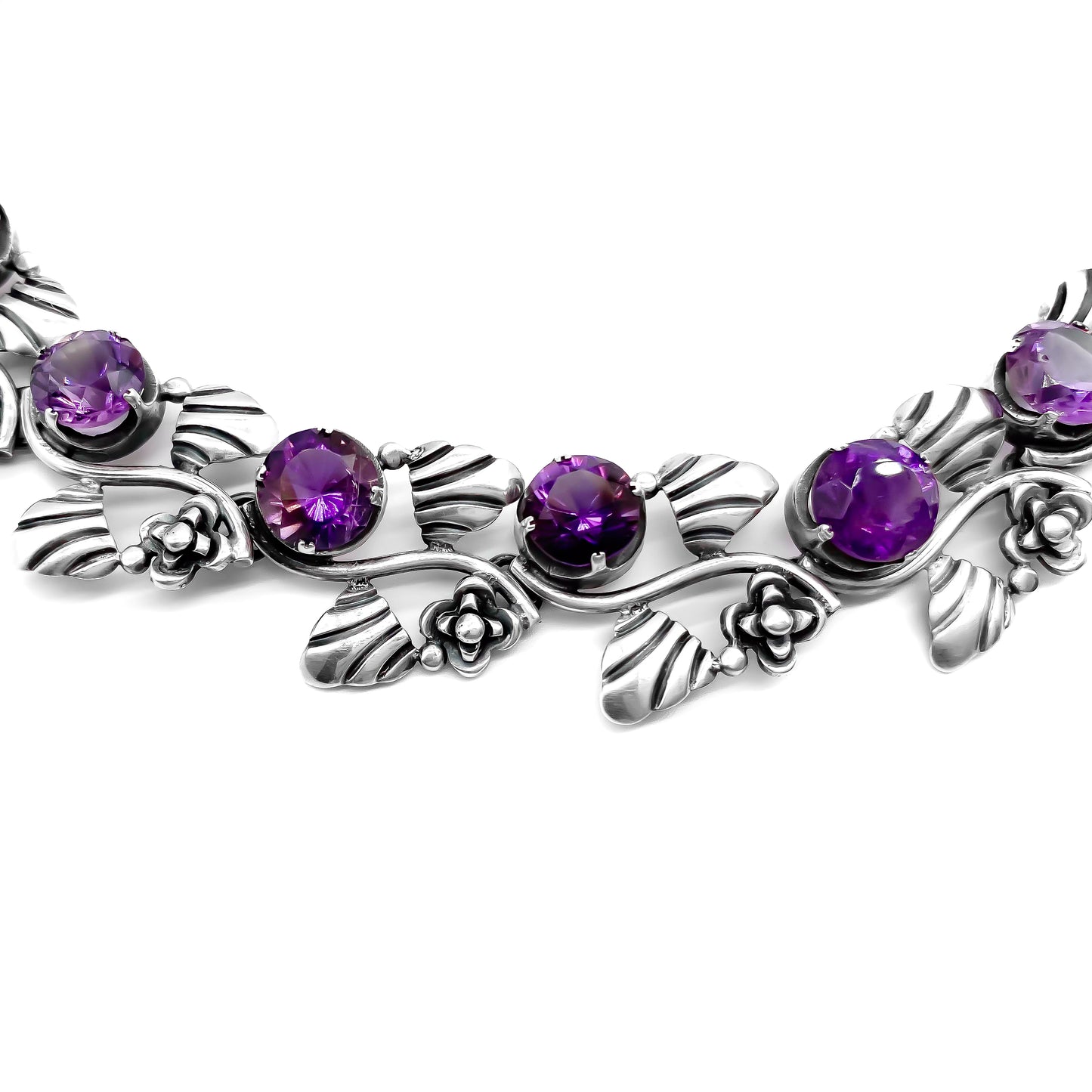 Stunning sterling silver Mexican choker necklace set with eighteen round, faceted amethysts. Circa 1950’s