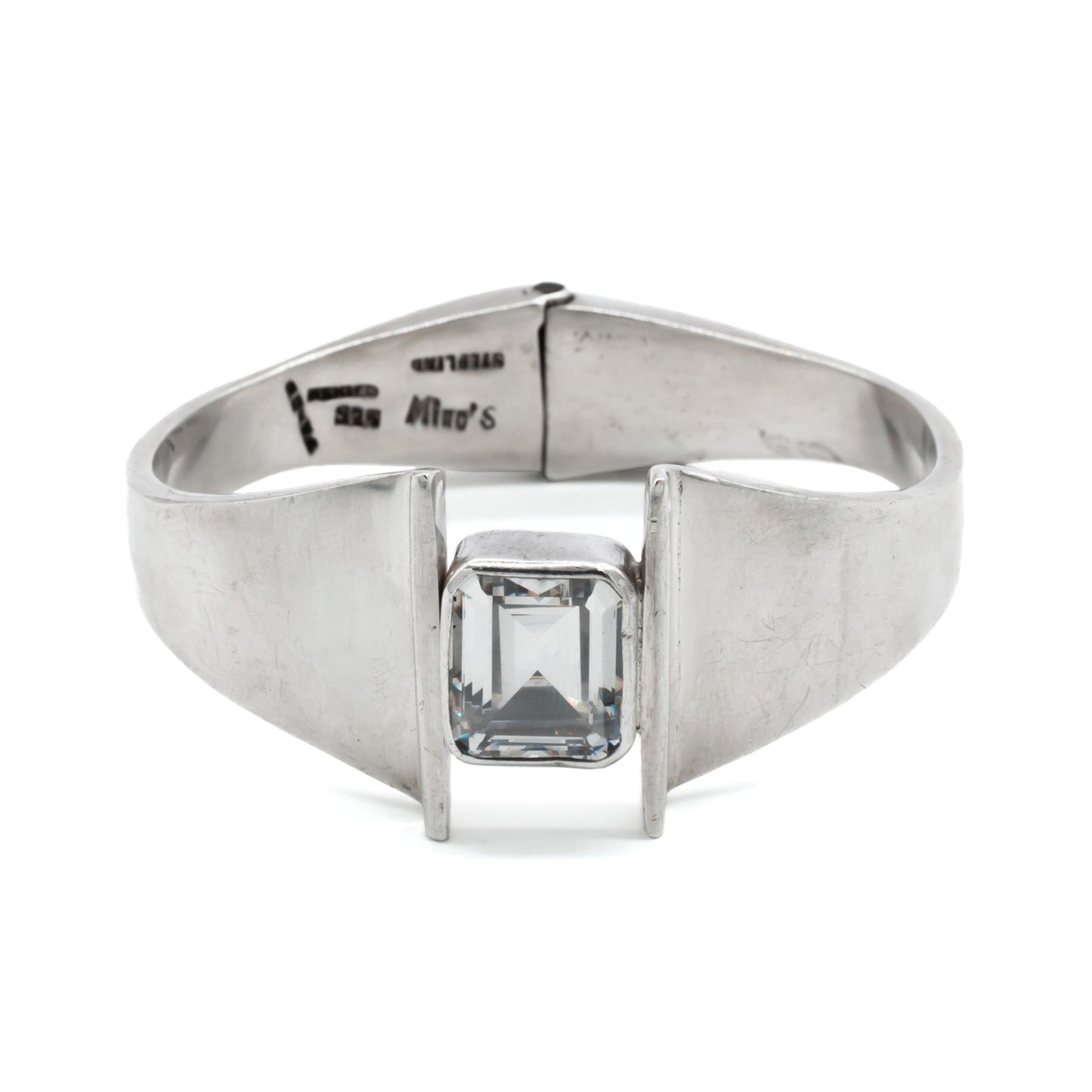 Stunning sterling silver Mexican modernist clamper bangle set with a rectangular rock crystal. Signed Mino’s. Post 1979