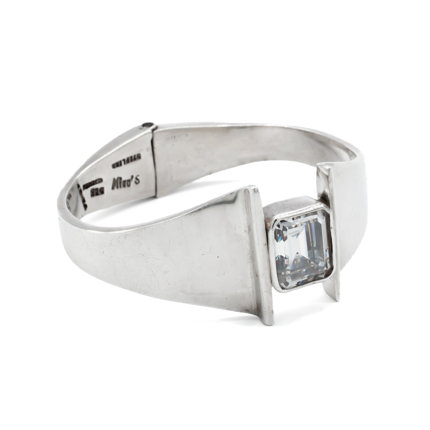 Stunning sterling silver Mexican modernist clamper bangle set with a rectangular rock crystal. Signed Mino’s. Post 1979