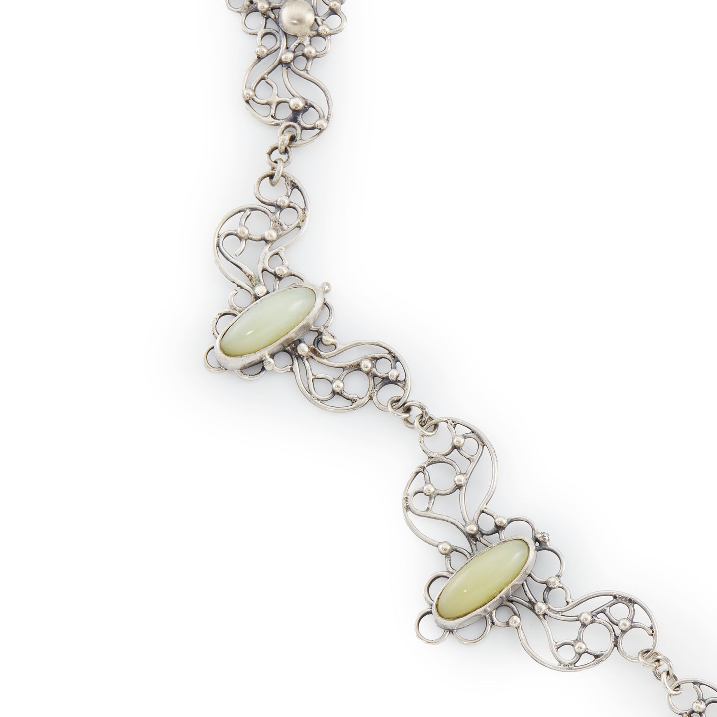 Beautiful mid-century silver festoon necklace with some oxidation and ornate detail. Set with three oval green chalcedony cabochon stones. Made in Poland. Company - Orno