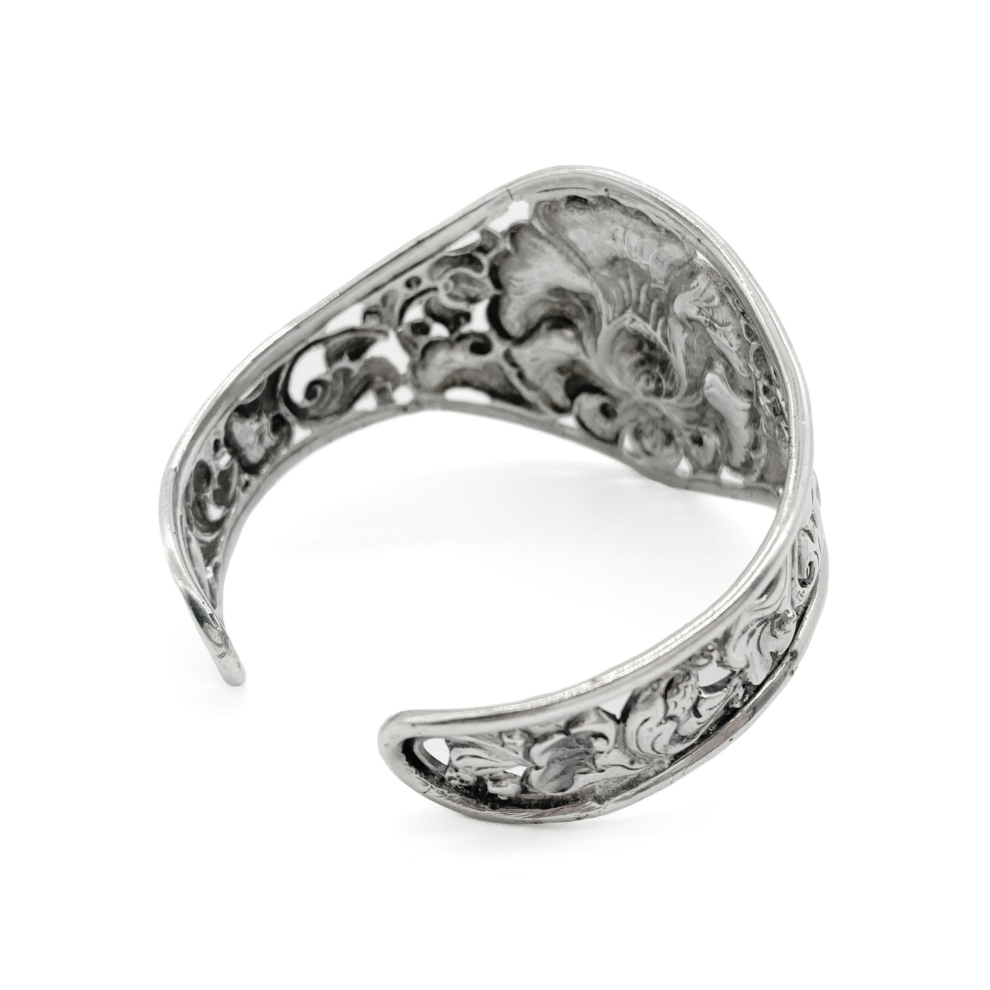 Gorgeous silver repoussé bangle with ornate detail. Open so size is adjustable. Circa 1930s