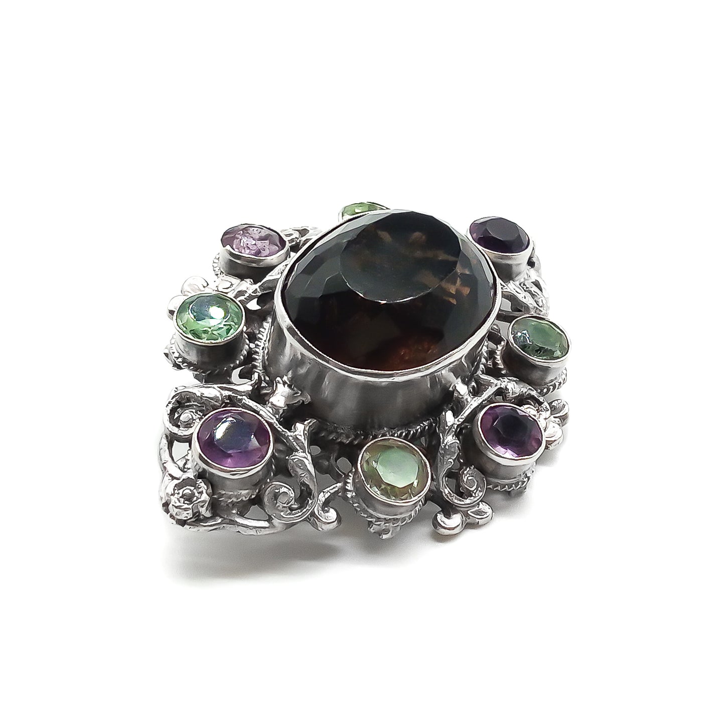 Stunning Arts and Crafts Zoltan White and Co. silver brooch set with a large oval smoky quartz and eight green and purple amethysts. Circa 1920’s