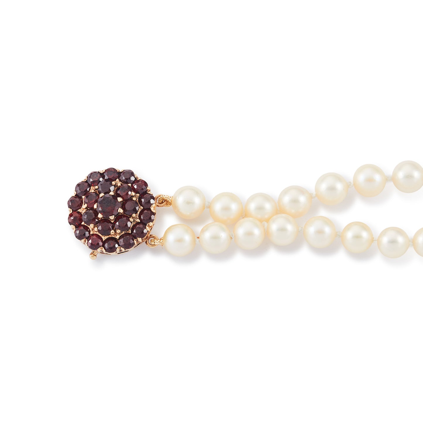 Exquisite double-strand seawater pearl bracelet with a stunning 9ct gold clasp set with twenty-two deep red garnets.