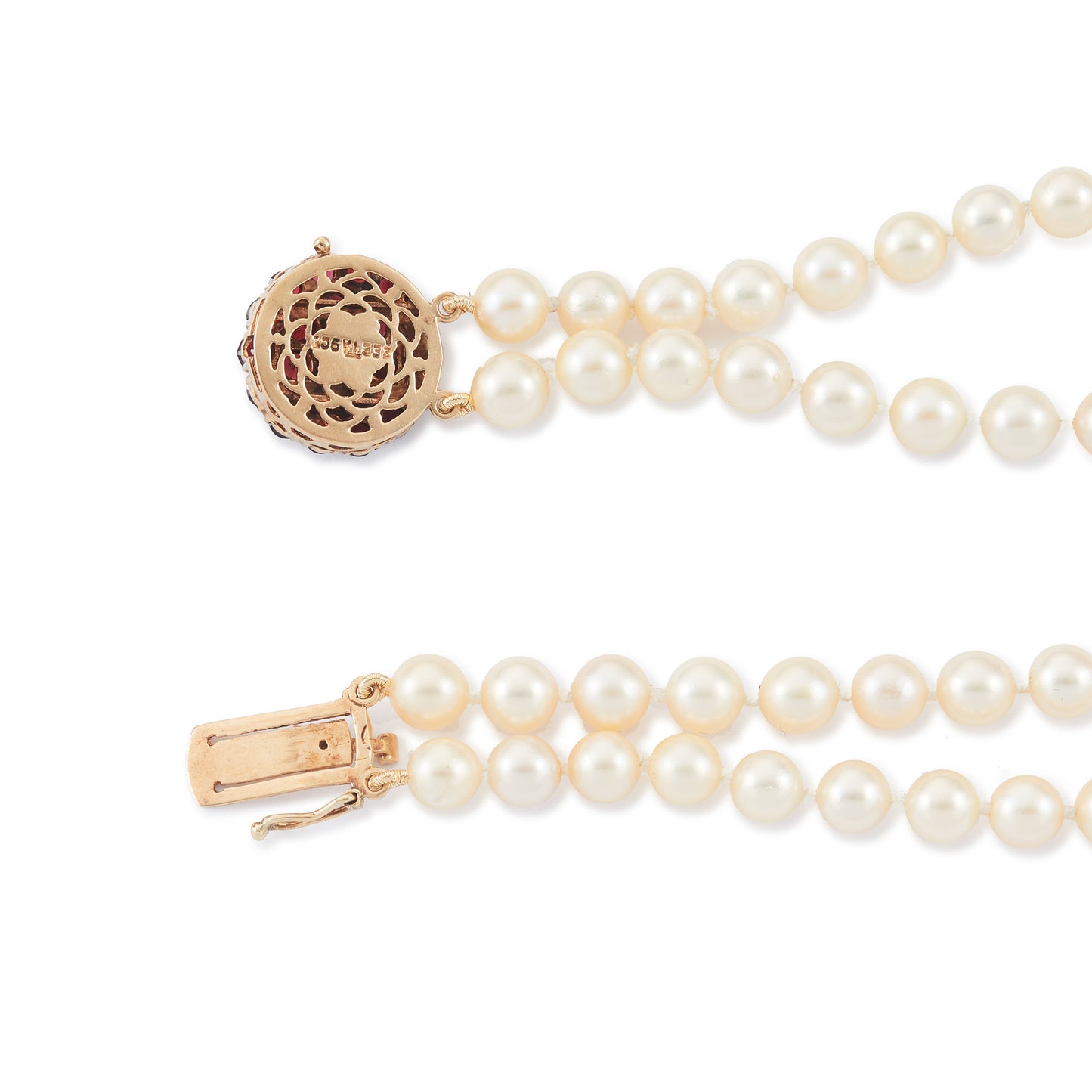 Exquisite double-strand seawater pearl bracelet with a stunning 9ct gold clasp set with twenty-two deep red garnets.