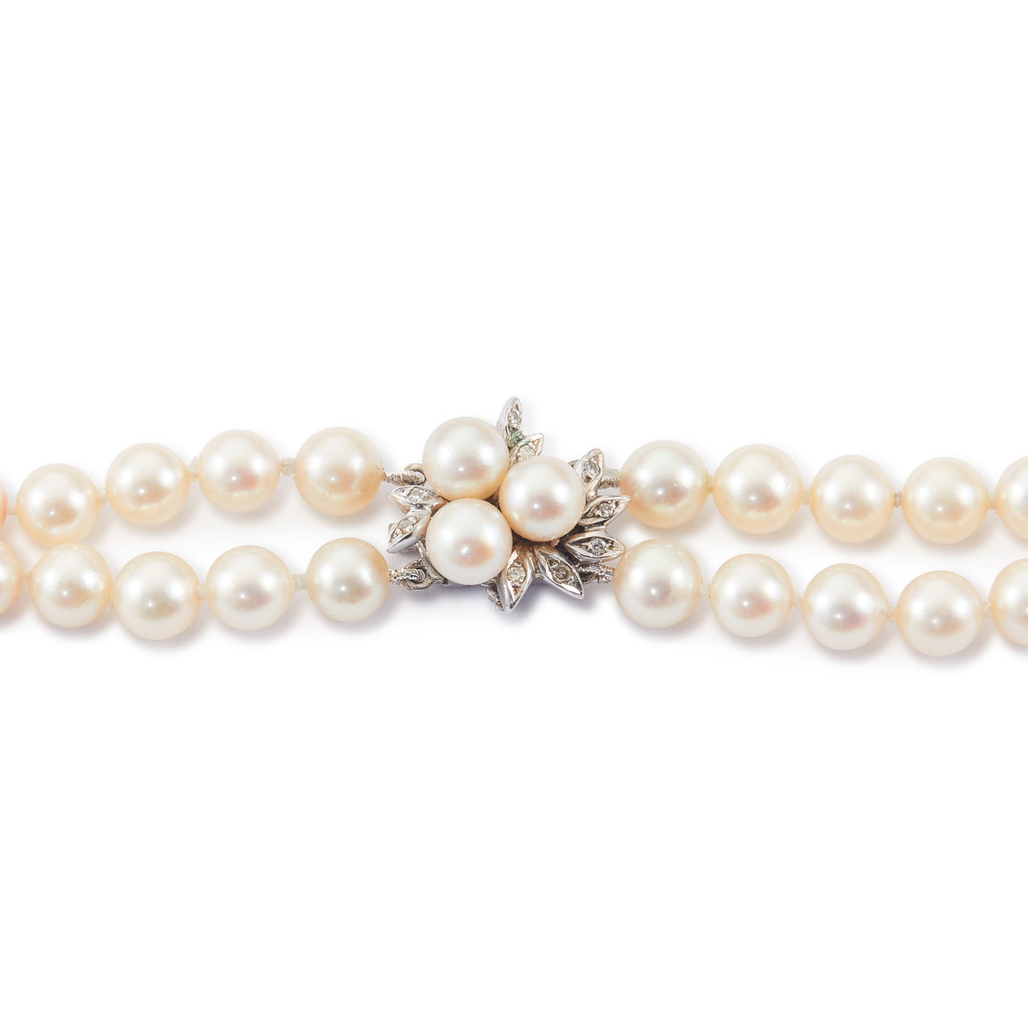 Exquisite double strand of lustrous cultured seawater pearls with a stunning 14ct white gold clasp set with nine small diamonds and three pearls. Can be worn as a choker or wrapped around the wrist as a four-strand bracelet.
