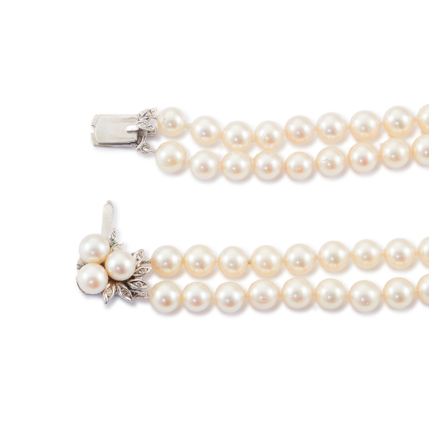 Exquisite double strand of lustrous cultured seawater pearls with a stunning 14ct white gold clasp set with nine small diamonds and three pearls. Can be worn as a choker or wrapped around the wrist as a four-strand bracelet.