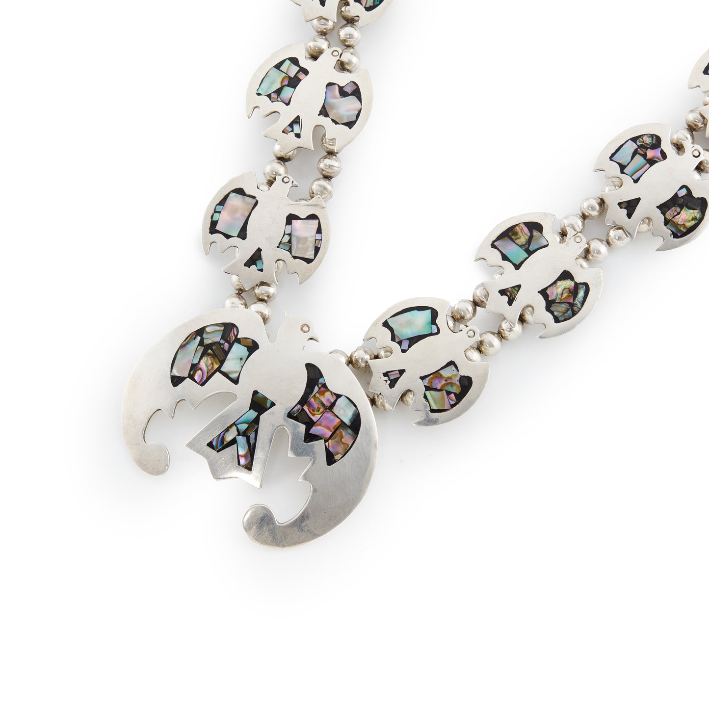 Stunning sterling silver Native American squash blossom necklace with abalone inlay in a beautiful eagle design. A real statement piece.