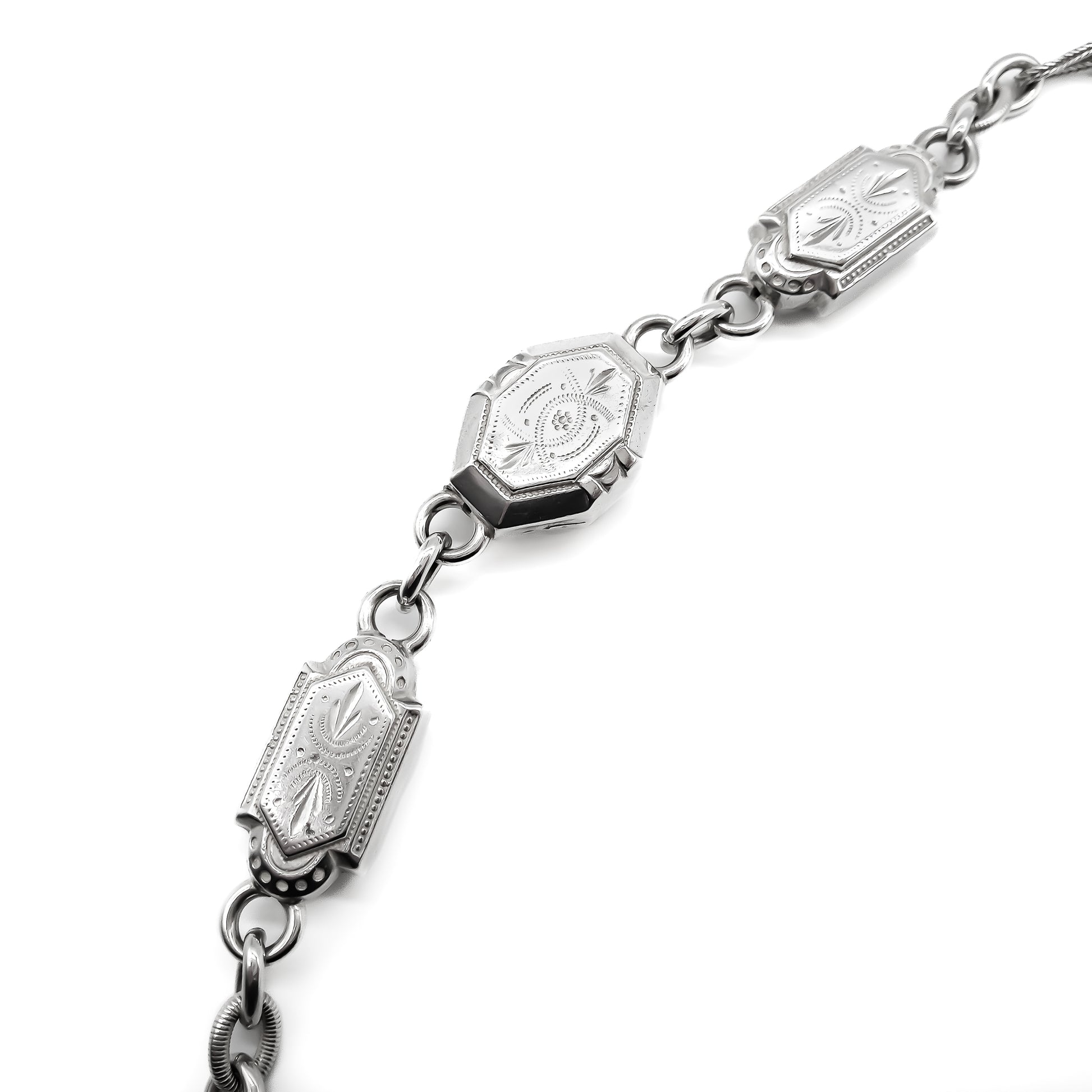 Magnificent silver Albertina necklace with ornate detail and dog-clip clasp. Italy. Circa 1900’s 