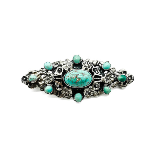 Ornate silver and turquoise Arts and Crafts brooch made by Zoltan White and Co. Circa 1920’s