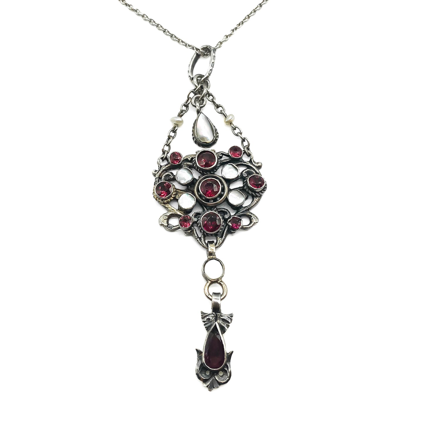 Intricate silver Austro-Hungarian garnet and pearl pendant with dangling drops, on a silver chain. Circa 1910