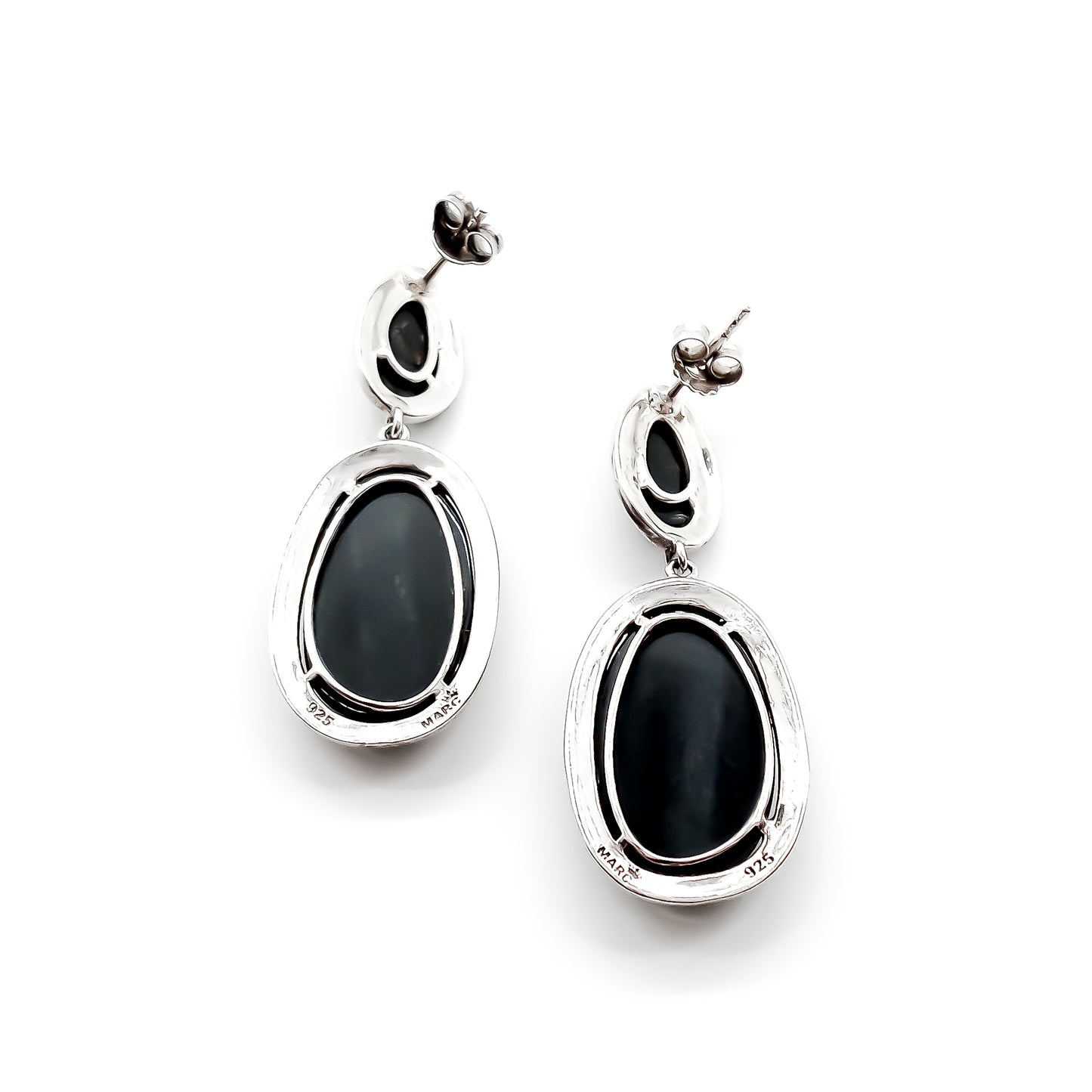 Stylish sterling silver drop earrings, each set with two black tiger’s eye cabochon stones, surrounded by marcasites. Circa 1950’s