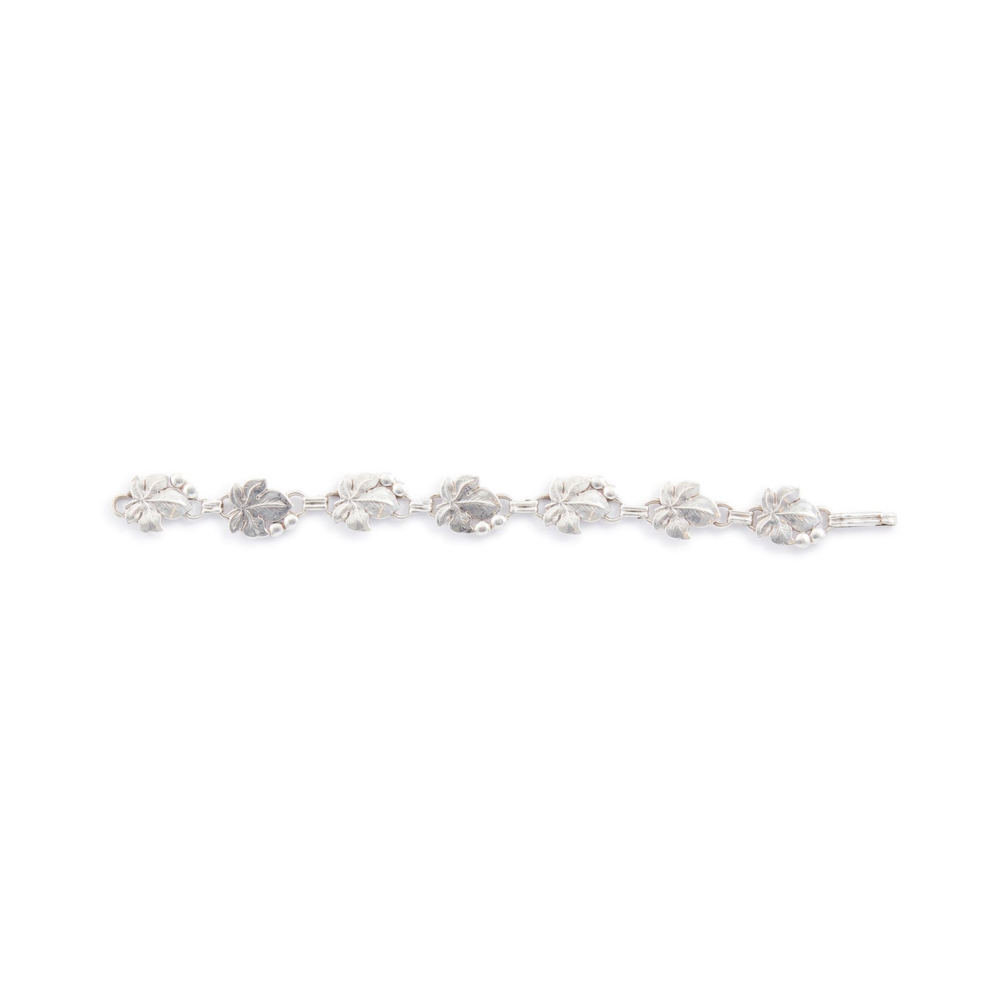 Classic silver Candida bracelet (unmarked) with seven linked grape vine leaves.
