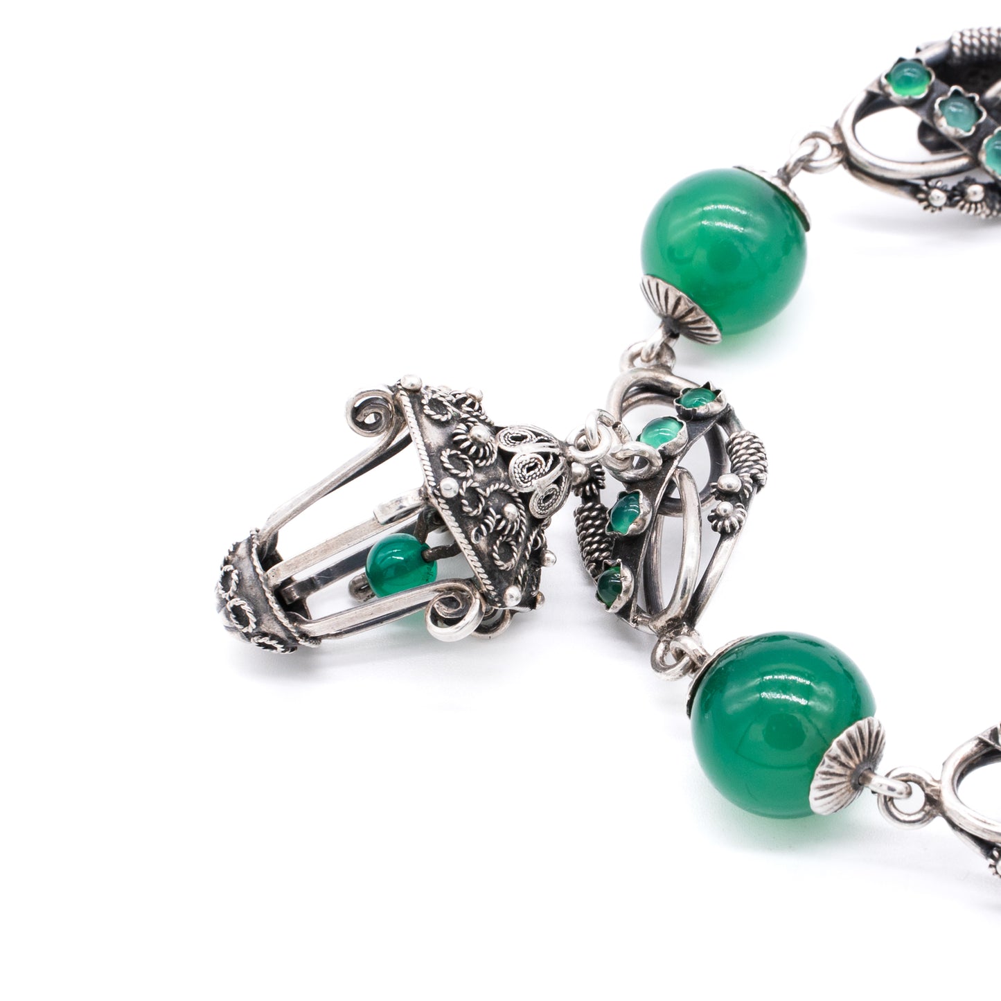 Silver Chrysoprase Magnificent silver filigree charm bracelet with four chrysoprase beads, sixteen chrysoprase cabochons and three intricate charms. Italy. Circa 1930’s