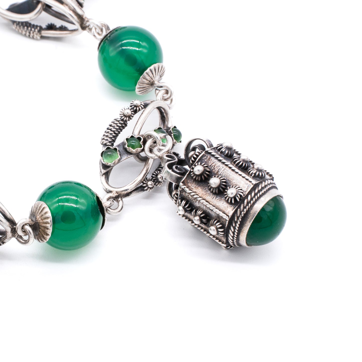 Silver Chrysoprase Magnificent silver filigree charm bracelet with four chrysoprase beads, sixteen chrysoprase cabochons and three intricate charms. Italy. Circa 1930’s