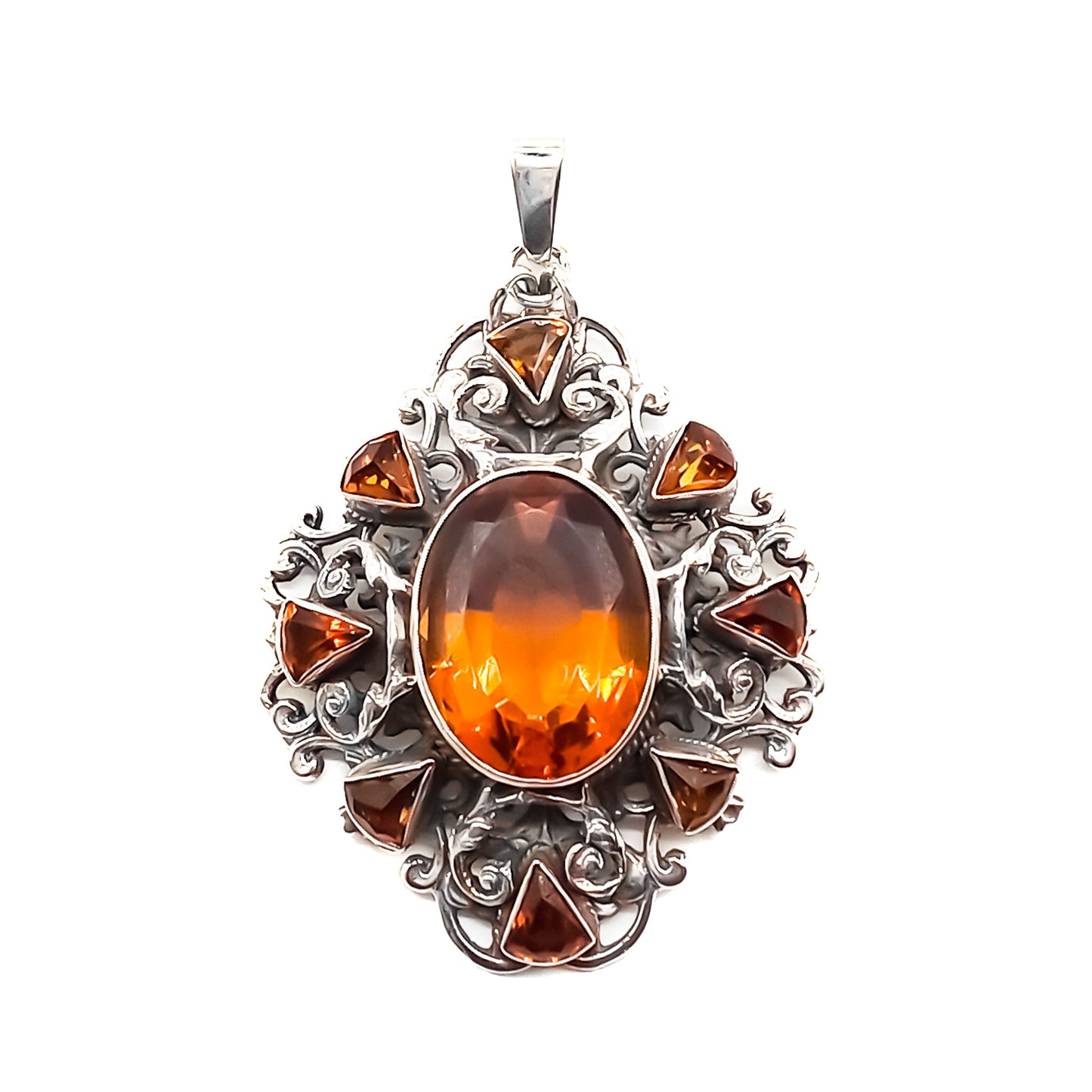 Very ornate sterling silver Arts and Crafts pendant set with a large, beautifully faceted citrine, surrounded by eight small triangular citrines. Circa 1920’s