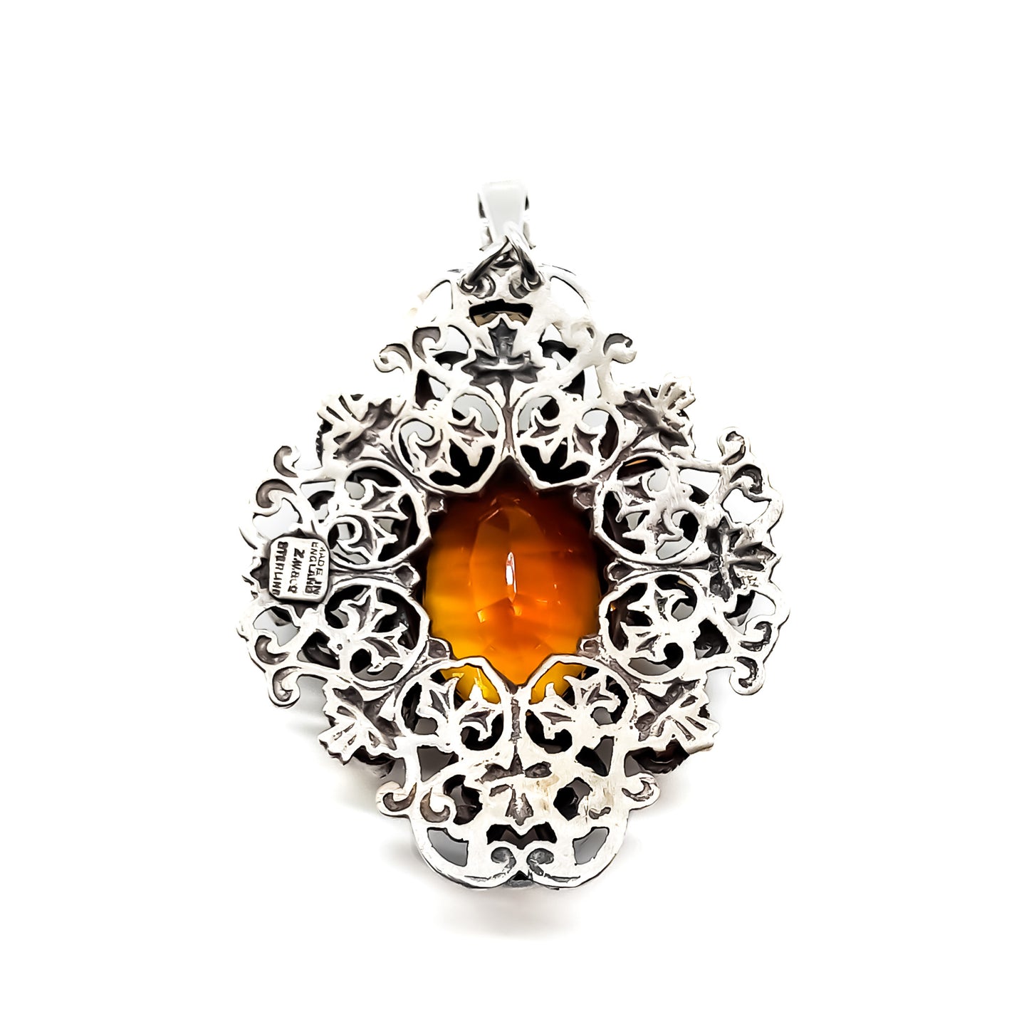 Very ornate sterling silver Arts and Crafts pendant set with a large, beautifully faceted citrine, surrounded by eight small triangular citrines. Circa 1920’s