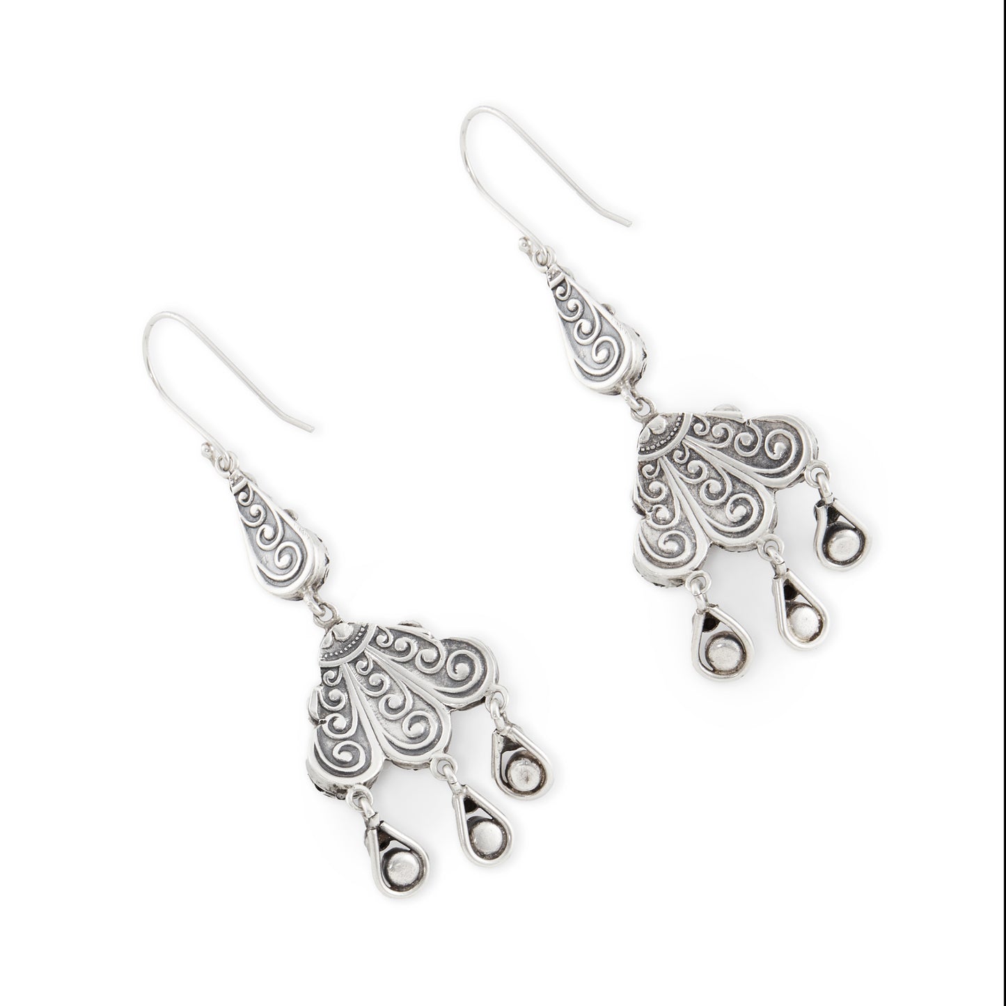 Elaborate silver dangling earrings, each set with six natural round coral beads and five green turquoise stones. Beautiful engraving on the backs of the earrings. Italy. Circa 1930’s