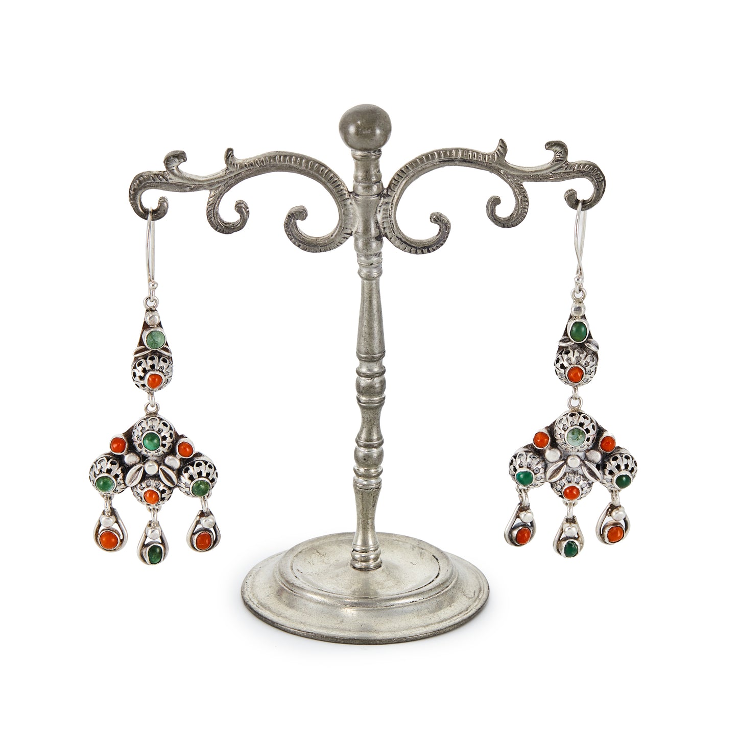 Elaborate silver dangling earrings, each set with six natural round coral beads and five green turquoise stones. Beautiful engraving on the backs of the earrings. Italy. Circa 1930’s