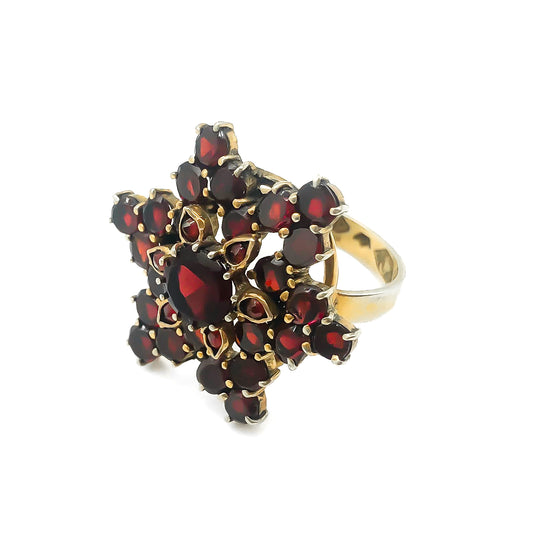 Vintage silver gilt ring set with bohemian garnets in a star design.